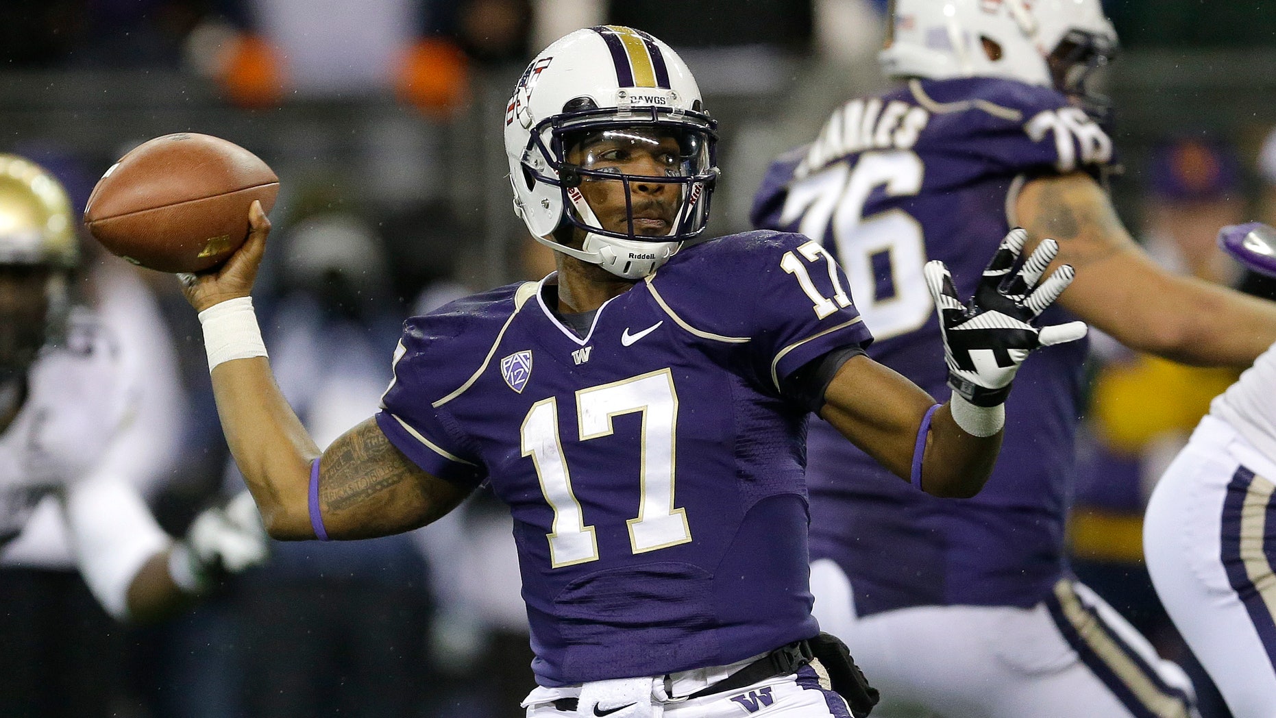 Washington quarterback Keith Price (17) passes against Colorado in the first half of an NCAA college football game on Saturday, Nov. 9, 2013, in Seattle. (AP Photo/Ted S. Warren)