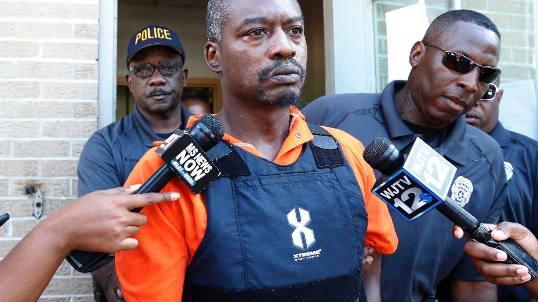 FILE - In this Aug. 29, 2016 file photo, Rodney Earl Sanders leaves the Durant Municipal Building after an initial appearance in court in Durant, Miss. Sanders was charged with two counts of capital murder in the slayings of Sisters Margaret Held and Paula Merrill, both 68. Sanders is scheduled for a court hearing, Friday, Sept. 16, where prosecutors will present evidence before the case goes to a grand jury. (AP Photo/Rogelio V. Solis)