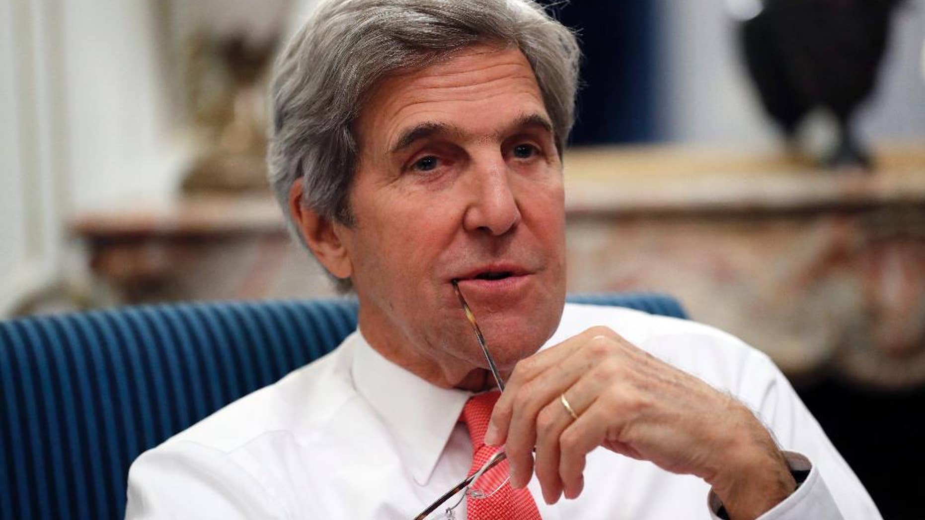 U.S Secretary of State John Kerry speaks with the media after attending the Mideast peace conference Sunday, Jan. 15, 2017 in Paris, France. Kerry, who has been increasingly outspoken about Mideast tensions, was in Paris defending American interests at the conference in his last major diplomatic foray before he leaves office. (AP Photo/Alex Brandon, Pool)