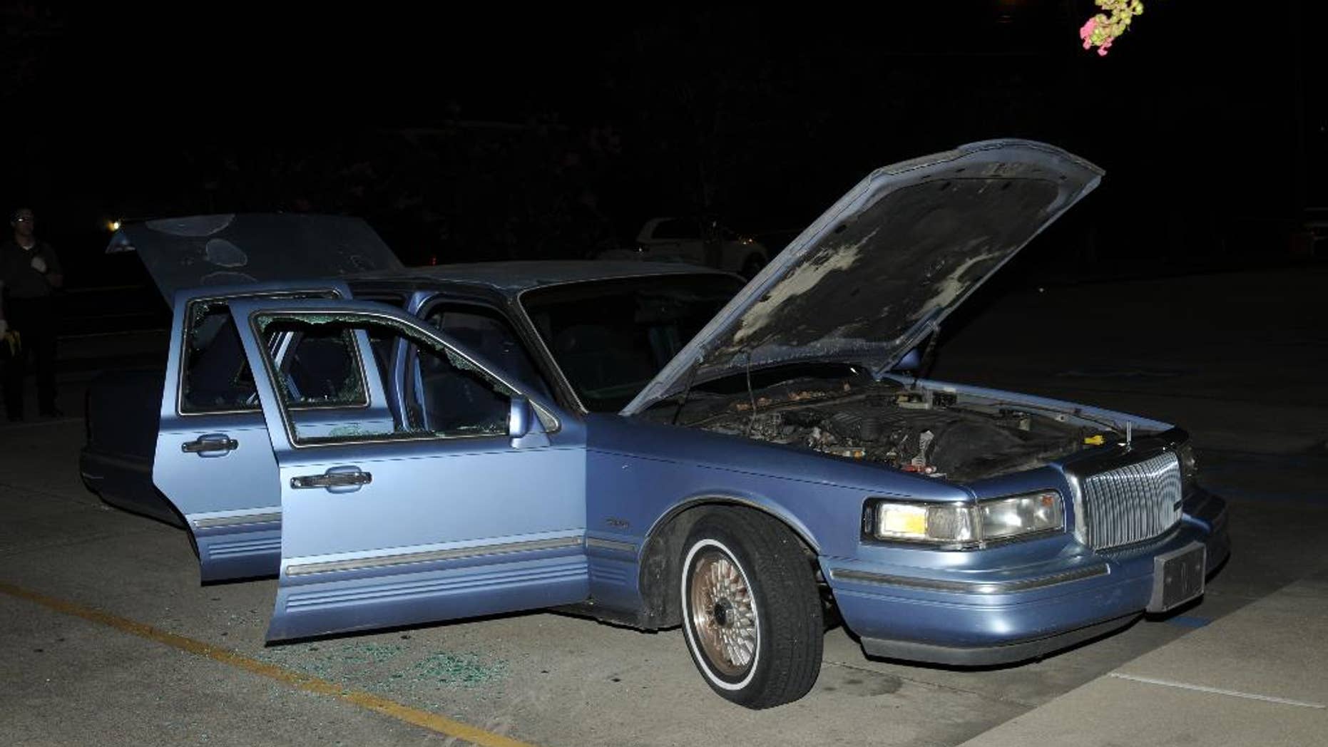 This undated photo provided by the Lafayette Police Department shows the car John Russel Houser was driving before he opened fire in a movie theater July 23, 2015, in Lafayette, La. Lafayette police said in an email Tuesday, July 28, that they are releasing the photographs in hopes that people may have seen the blue 1995 Lincoln Continental and may remember encountering Houser. (Lafayette Police Department via AP)
