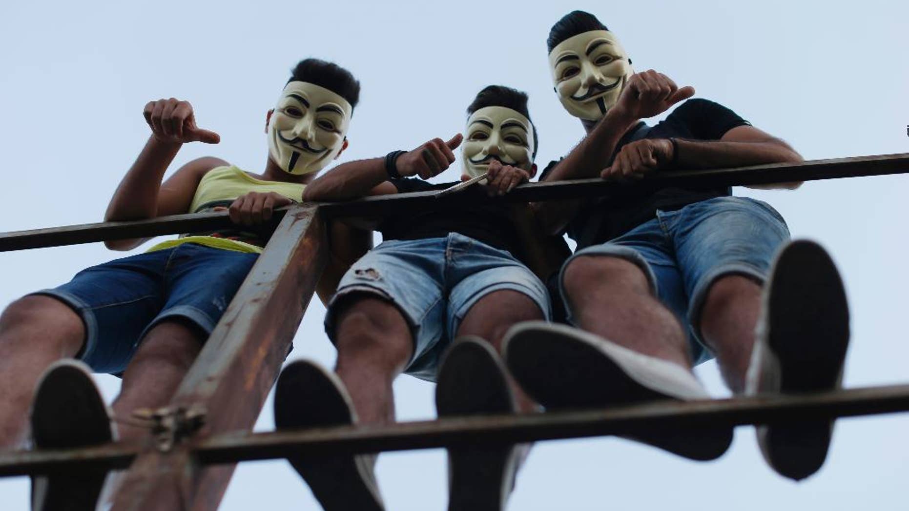 Lebanese anti-government protesters react during a demonstration against the on-going trash crisis and government corruption, in downtown Beirut, Lebanon, Saturday, Aug. 29, 2015. Thousands of people began gathering Saturday amid tight security in downtown Beirut, ahead of a major rally to protest government corruption and the country's dysfunctional political system. (AP Photo/Hassan Ammar)