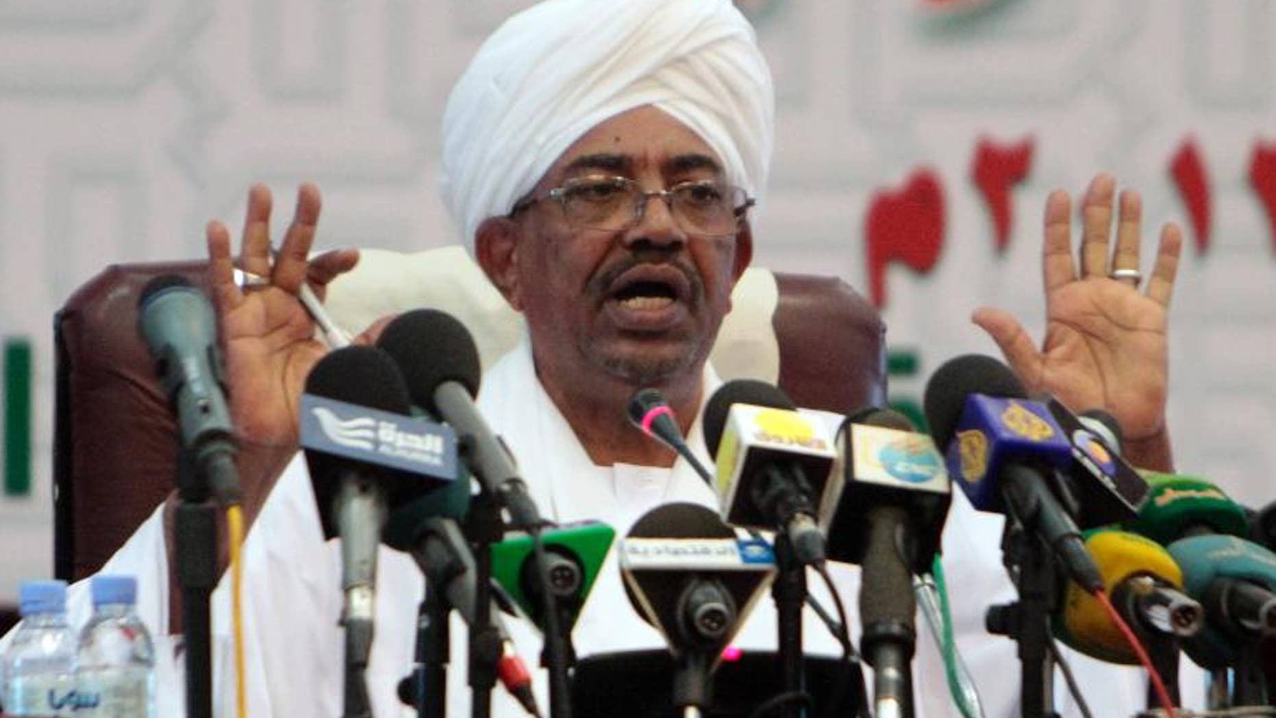 Sudanese President Omar al-Bashir speaks during a press conference in Khartoum, on September 22, 2013