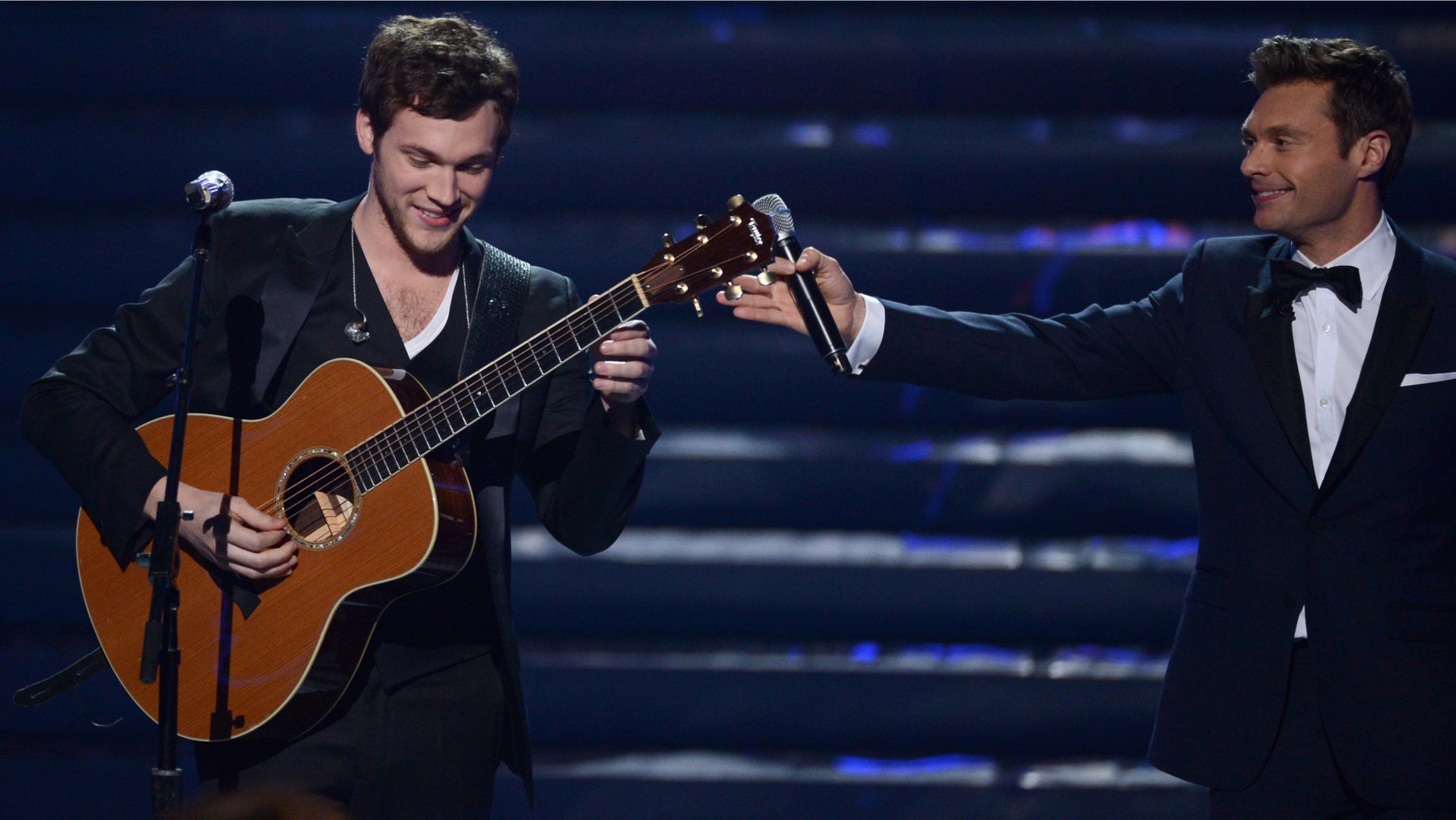 May 23, 2012: Winner Phillip Phillips and host Ryan Seacrest speak onstage during Fox's "American Idol 2012" results show at Nokia Theatre L.A. Live in Los Angeles, California.