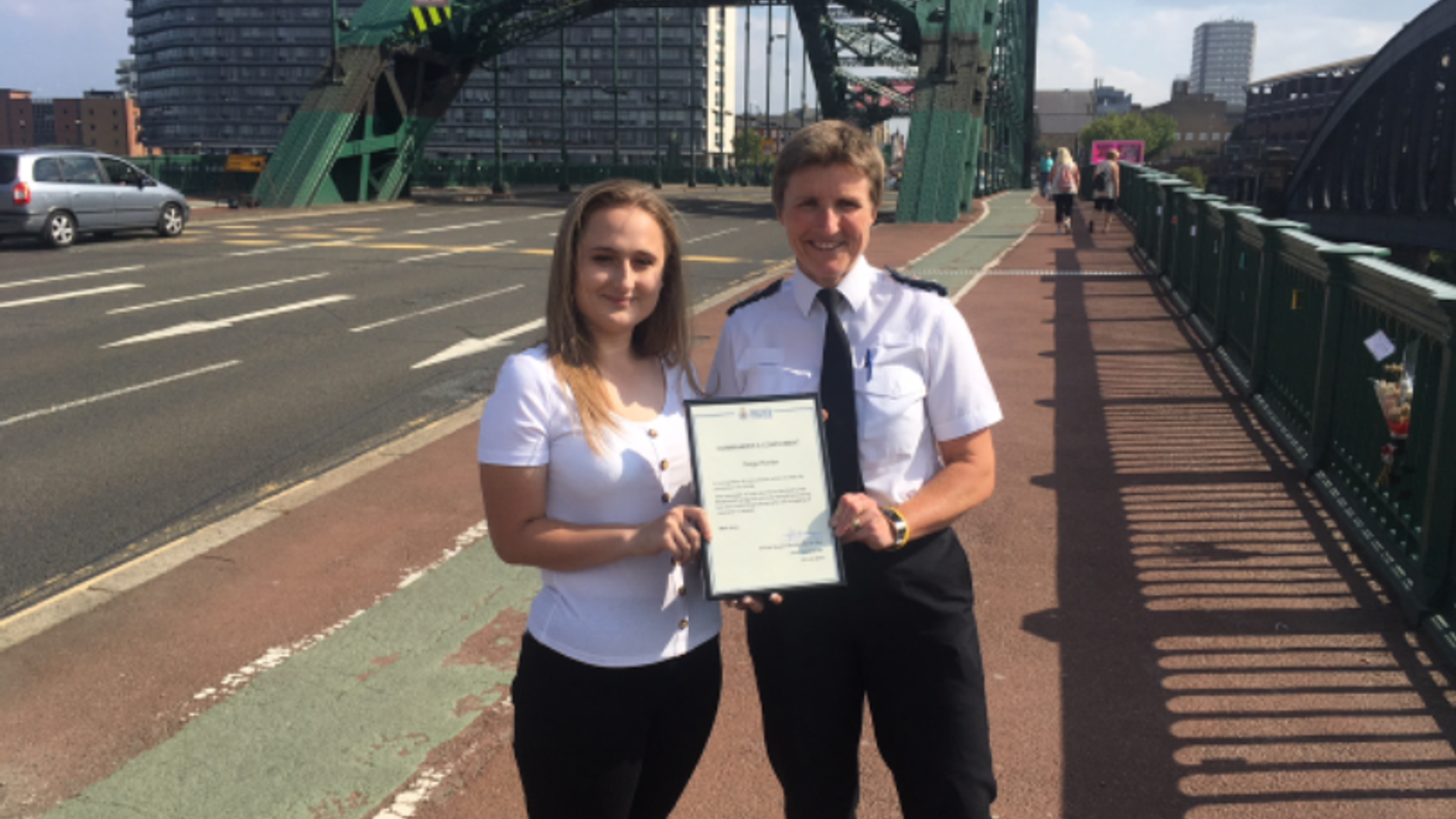 Paige Hunter, left, was commended by Northumbia Police Chief Superintendent Sarah Pitt for leaving more than 40 "heartfelt notes" on the Wearmouth Bridge in Sunderland, England.