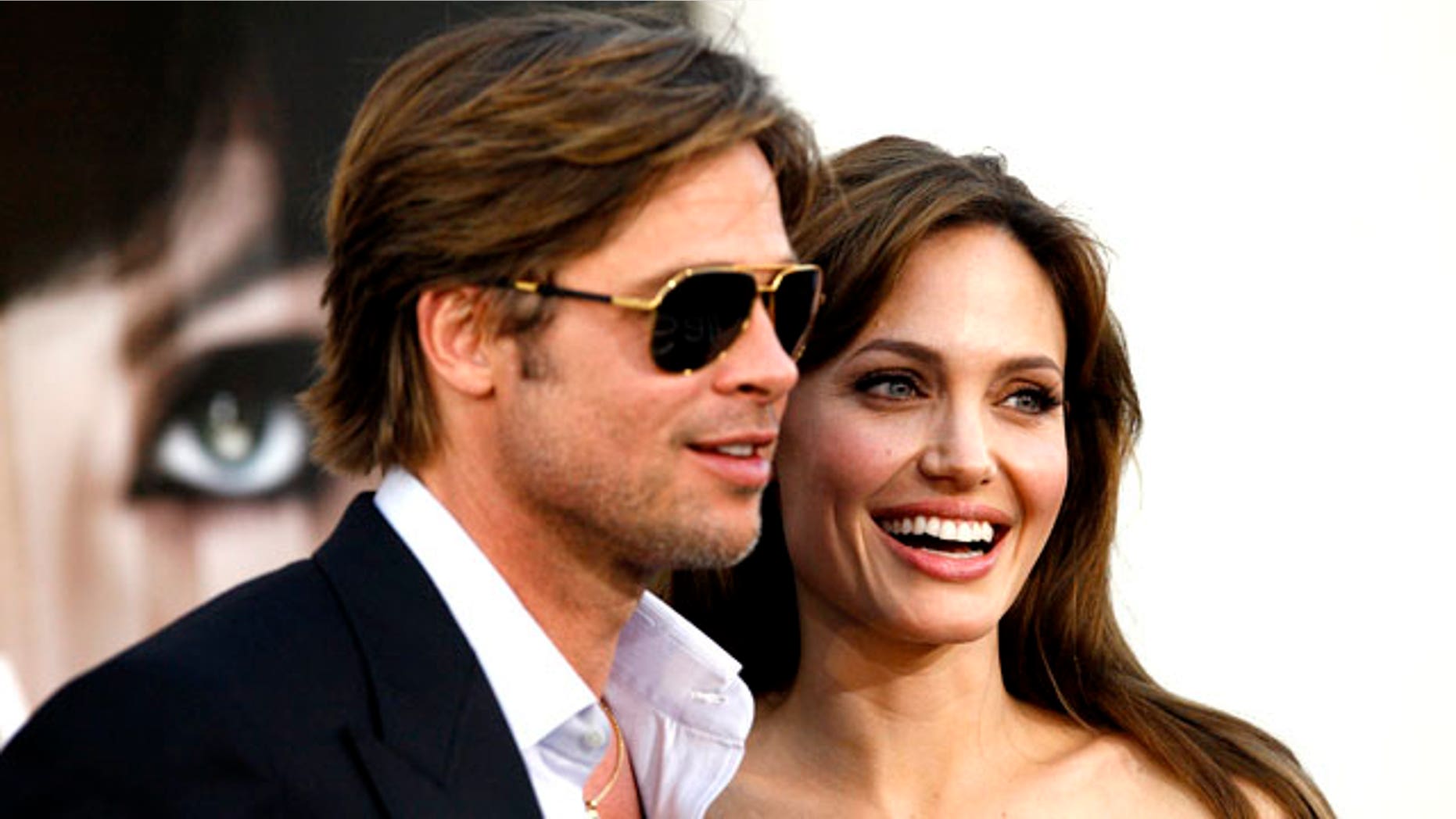 Angelina Jolie and actor Brad Pitt pose at the premiere of "Salt" in Hollywood, California July 19, 2010. (Reuters)