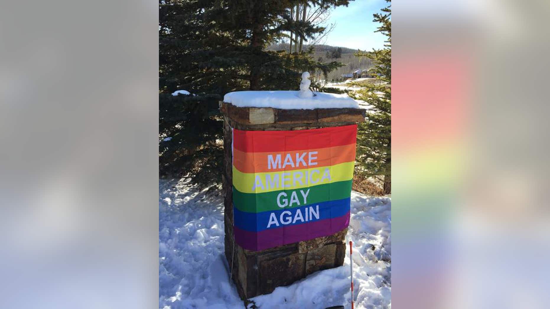 A rainbow banner reading "Make America Gay Again" appeared in front of the house where Pence is staying.