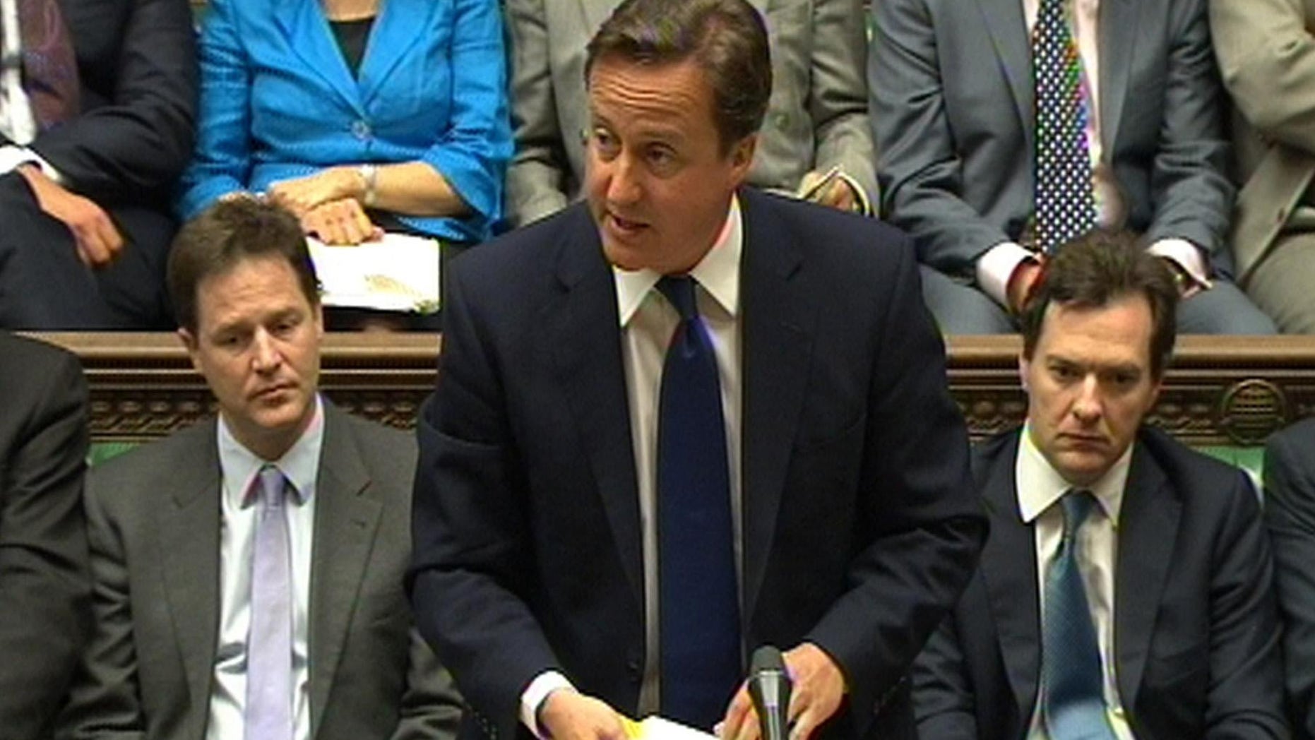 June 8: In this video image British Prime Minister David Cameron speaks during Prime Minister's Questions in the House of Commons, London, flanked by Deputy Prime Minister Nick Clegg, left, and Treasury chief George Osborne. Cameron says Britain and France will put forward a resolution at the United Nations condemning the crackdown in Syria. Cameron told the House of Commons that the two nations wish to condemn the repression by Bashar Assad's government. (AP/PA Wire)