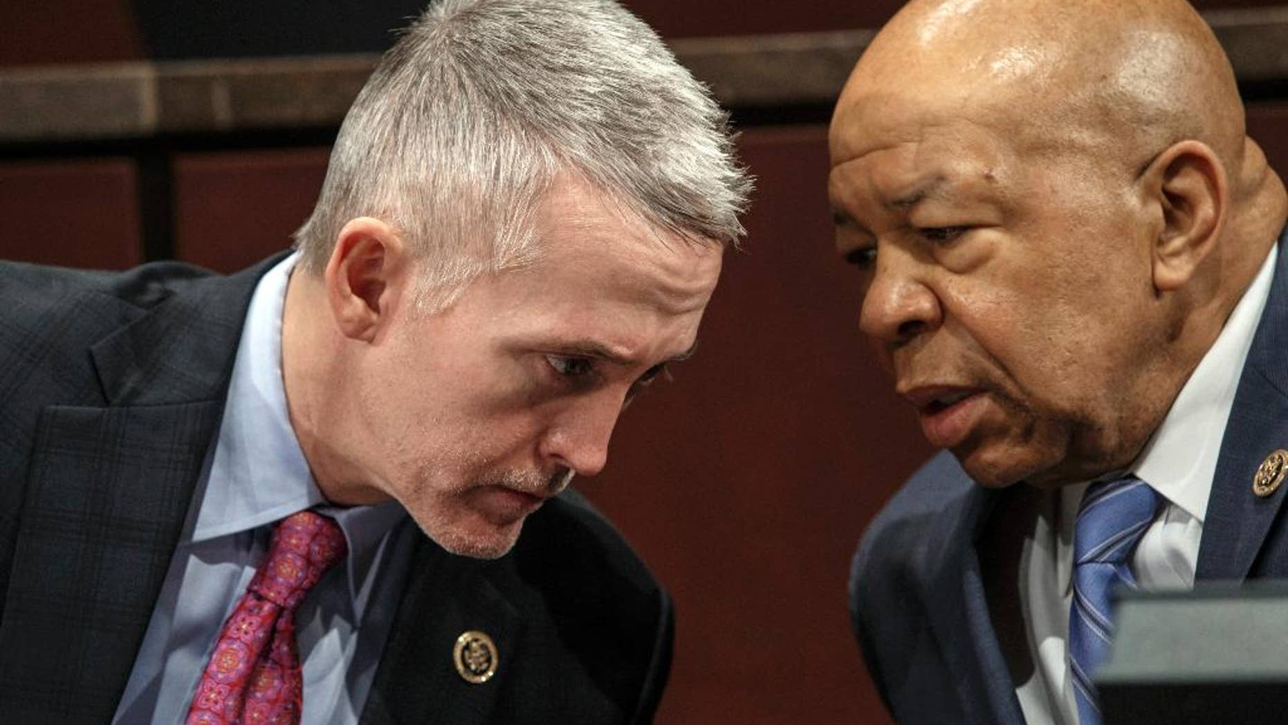 FILE - In this Jan. 27, 2015, file photo, House Benghazi Committee Chairman Rep. Trey Gowdy, R-S.C., left, confers with the committee's ranking member Rep. Elijah Cummings, D-Md., during the committee's hearing on Capitol Hill in Washington. The committee has missed a self-imposed deadline to issue a report “before summer," the latest setback for a probe that has gone on for more than two years and drawn scorn from Democrats who say the primary goal of the Republican-led investigation is to undermine Hillary Clinton's presidential bid.(AP Photo/J. Scott Applewhite, File)