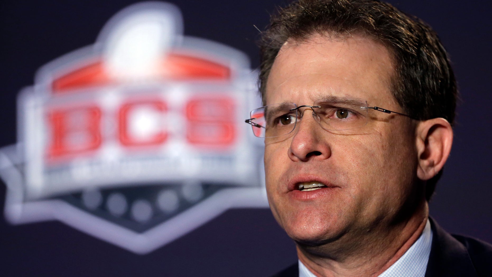 Auburn head coach Gus Malzahn answers a question during a news conference for the NCAA BCS National Championship college football game Sunday, Jan. 5, 2014, in Newport Beach, Calif. Florida State plays Auburn on Monday, Jan. 6, 2014. (AP Photo/David J. Phillip)