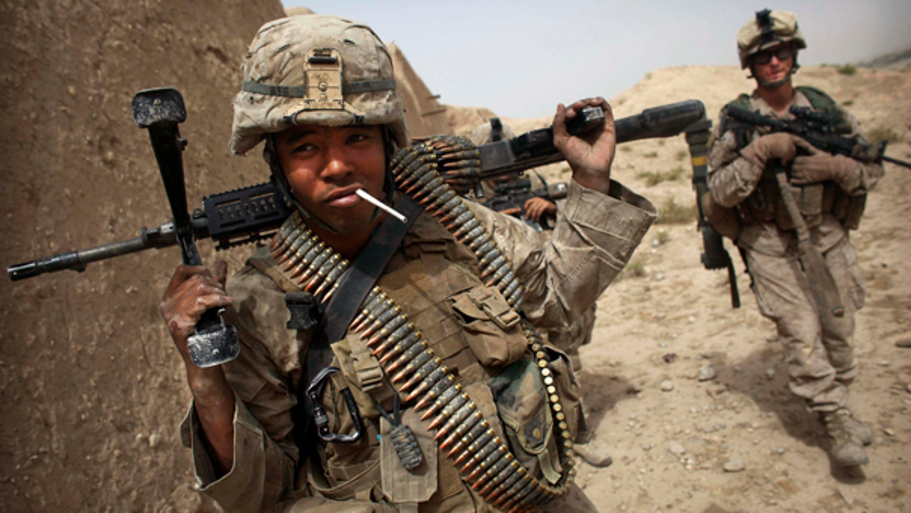 July 23: A U.S. Marine has a cigarette following a gun battle attempting to clear the area of insurgents in Helmand Province in southern Afghanistan.