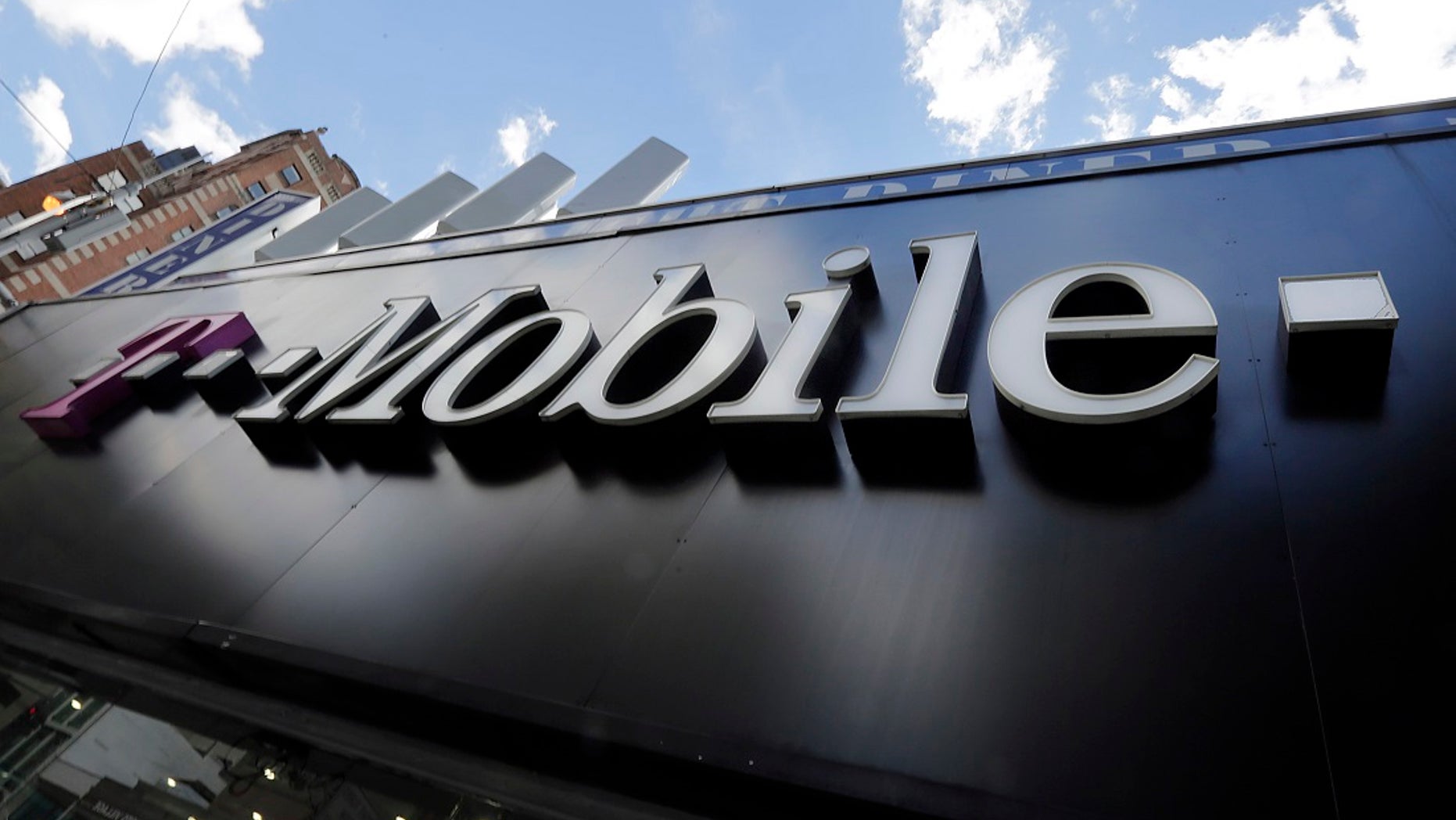 A T-Mobile store is shown in New York in this file photo. T-Mobile is being sued by a woman after a caretaker looking after her son was on hold while attempting to get in contact with 911.