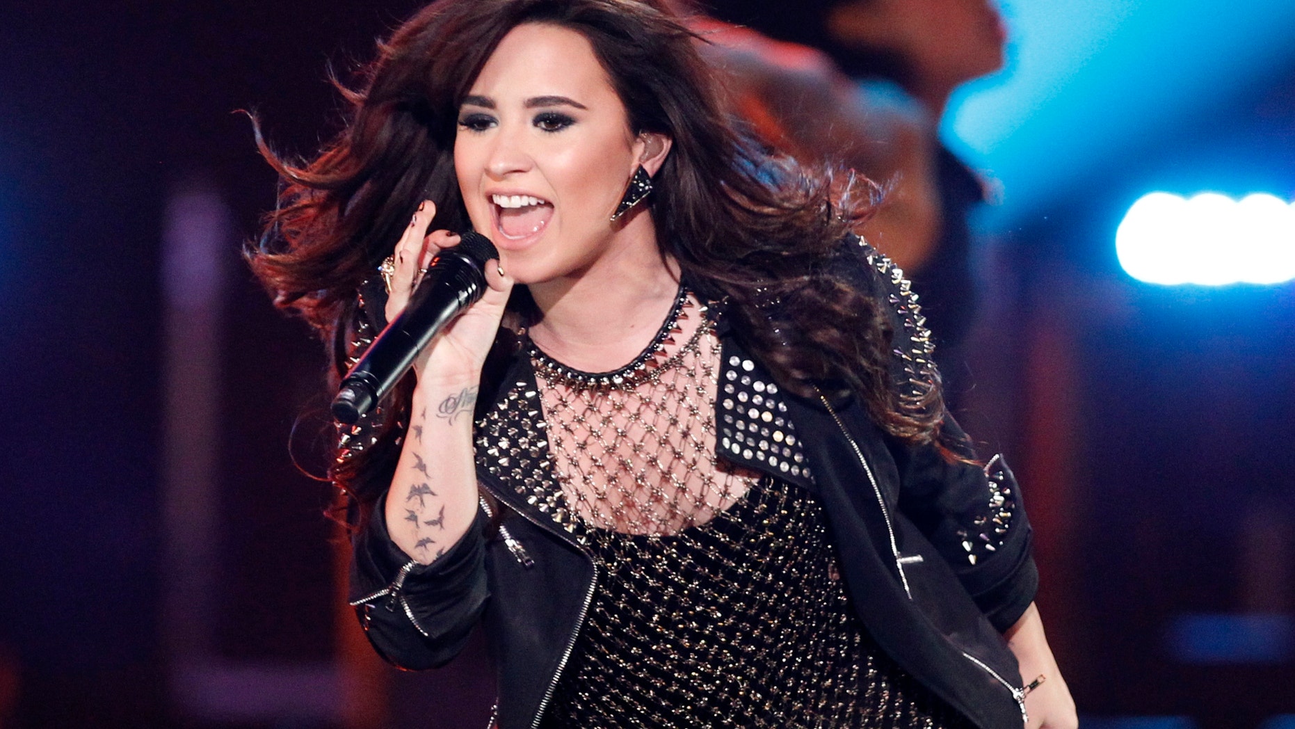 Recording artist Demi Lovato performs "Give Your Heart a Break" during the VH1 Divas 2012 show in Los Angeles, December 16, 2012.