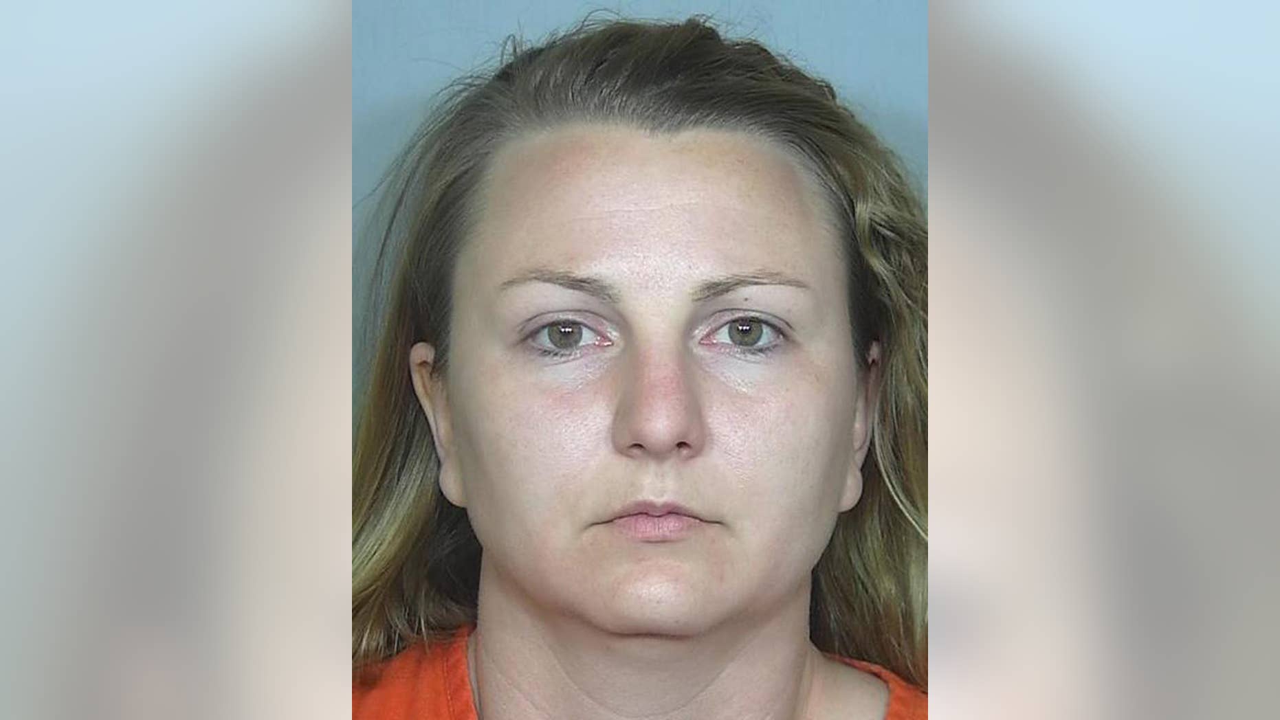 This booking photo provided by the Weld County, Colo., Sheriff's Department on Tuesday, May 17, 2016 shows Rachel Einspahr. Investigators say that Einspahr, who was baby sitting two children at the time, robbed a bank in Severance, Colo., on Friday, May 13, 2016, to get cash to pay back money that she stole from two northern Colorado businesses where she worked. (Weld County, Colo., Sheriff's Department via AP)