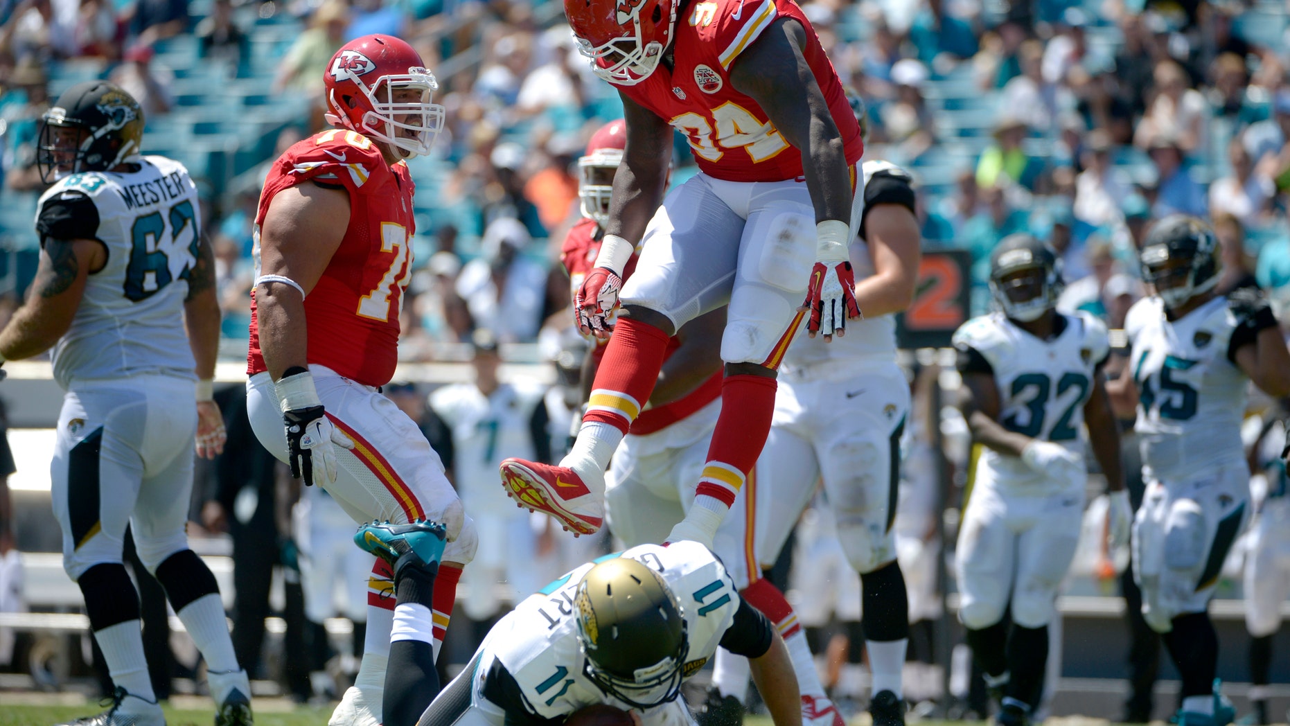 FILE - In this Sept. 8, 2013, file photo, Kansas City Chiefs defensive end Tyson Jackson (94) celebrates after sacking Jacksonville Jaguars quarterback Blaine Gabbert (11) as defensive end Mike DeVito (70) joins during an NFL football game in Jacksonville, Fla. Jacksonville has lost its first seven games by an average of nearly 21 points. (AP Photo/Phelan M. Ebenhack, File)