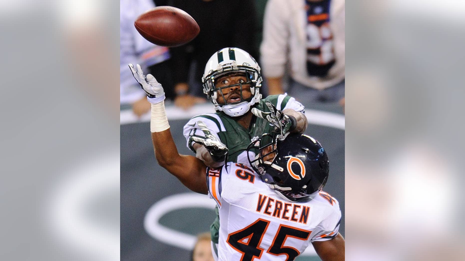 FILE - In a Sept. 22, 2014, file photo, New York Jets wide receiver Jeremy Kerley goes up for a pass into the end zone against Chicago Bears strong safety Brock Vereen (45) during the fourth quarter of an NFL football game in East Rutherford, N.J. The New York Jets announced Tuesday Oct. 21, 2014, they have signed Kerley to a four-year contract extension. (AP Photo/Bill Kostroun, file)