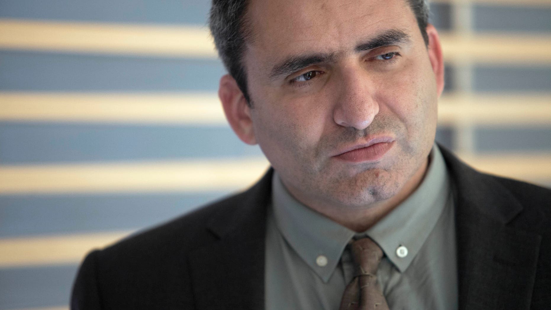 In this Sunday, May 26, 2013 photo, Israeli Deputy Foreign Minister Zeev Elkin listens during an interview with the Associated Press in Jerusalem. Elkin makes no apologies for his ideology or background, and says the world better get used to Jewish settlers holding positions of influence in Israel. (AP Photo/Dan Balilty)