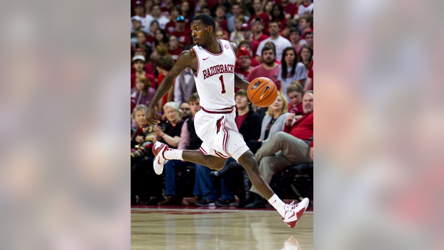 FILE - In this Dec. 4, 2012, fil ephoto, Arkansas' Mardracus Wade moves the ball up court during the first half of an NCAA college basketball game against Oklahoma in Fayetteville, Ark. Arkansas coach Mike Anderson is looking for a third scoring option to compliment. He'd love nothing better than for that option to become Wade, last season's SEC leader in 3-point percentage who has fallen on hard shooting times so far this season heading into Wednesday night's game with Auburn(AP Photo/Gareth Patterson, File)