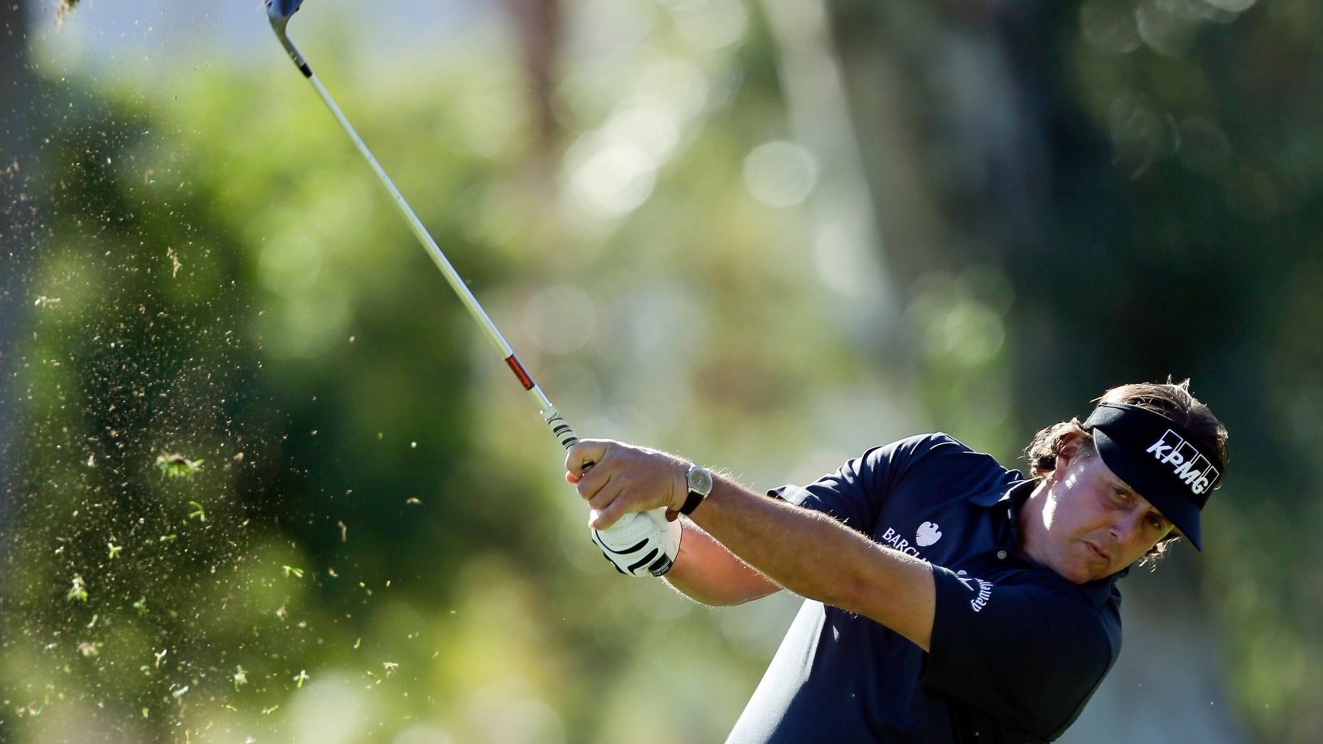 Phil Mickelson hits from a fairway on the fifth hole during the first round of the Humana Challenge golf tournament at the La Quinta Country Club in La Quinta, Calif., Thursday, Jan. 17, 2013. (AP Photo/Chris Carlson)
