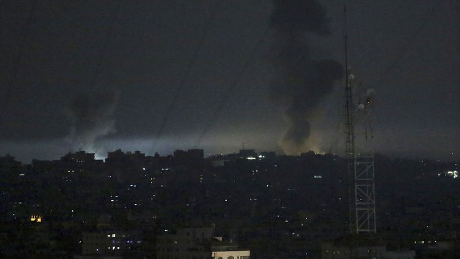 Smoke rises following an Israeli strikes on Gaza City, early Wednesday, May 30, 2018. Palestinian militants in the Gaza Strip fired at least 50 rockets and mortars into southern Israel on Tuesday, the largest barrage since the 2014 war between Israel and Hamas.