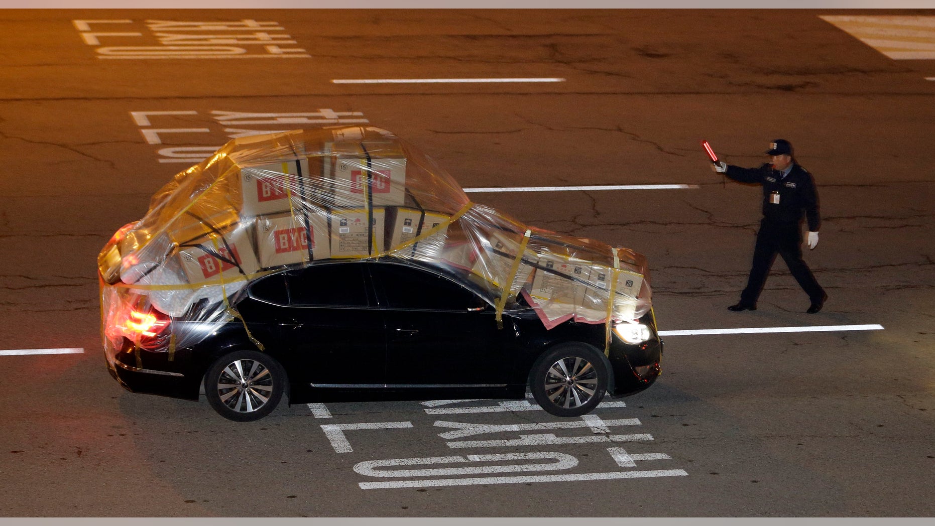 A South Korean vehicle fully loaded with goods and products brought back from North Korea's Kaesong industrial complex arrives at the customs, immigration and quarantine office near the border village of Panmunjom, that has separated the two Koreas since the Korean War, in Paju, north of Seoul, South Korea, Tuesday, April 30, 2013. North Korea on Monday approved the withdrawal of most of the remaining South Korean personnel at a jointly run industrial park in the North, South Korean officials said, with a final seven set to stay behind to negotiate unpaid wages for North Korean workers. (AP Photo/Lee Jin-man)