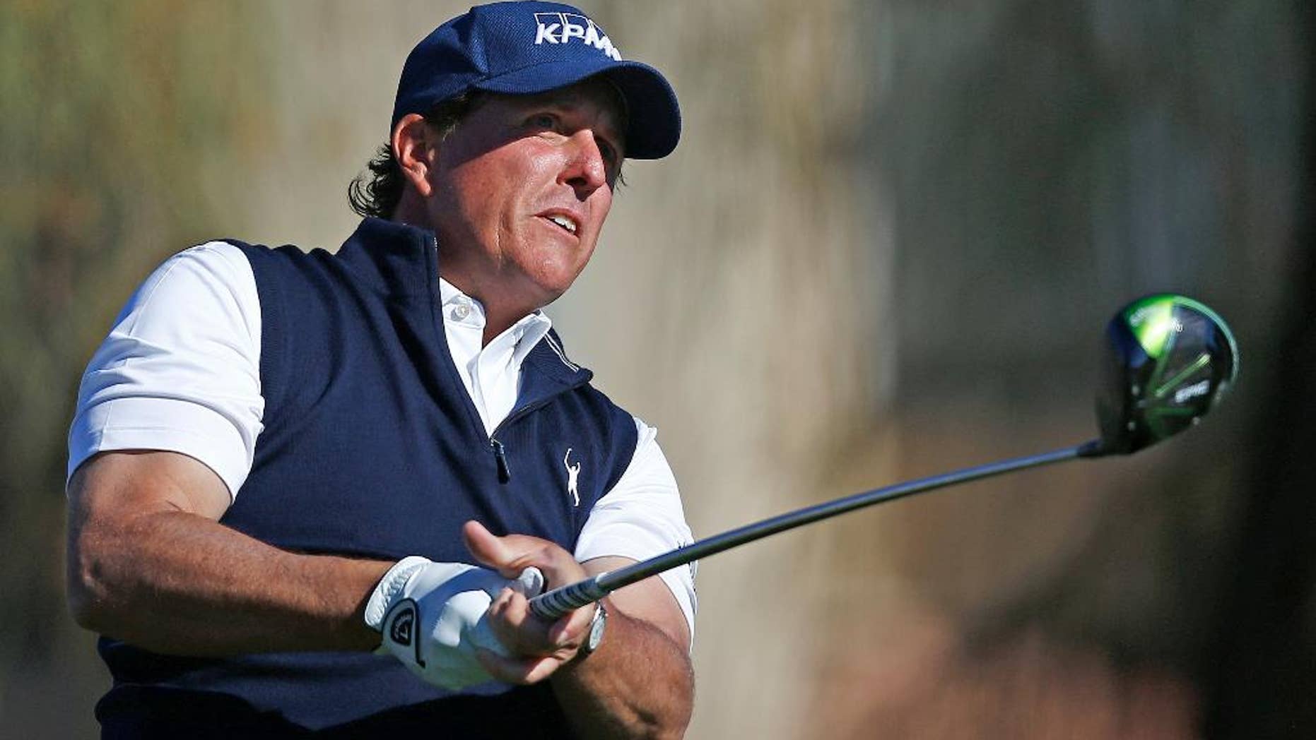Phil Mickelson watches his tee shot at the second hole during the final round of the Waste Management Phoenix Open golf tournament Sunday, Feb. 5, 2017, in Scottsdale, Ariz. (AP Photo/Ross D. Franklin)
