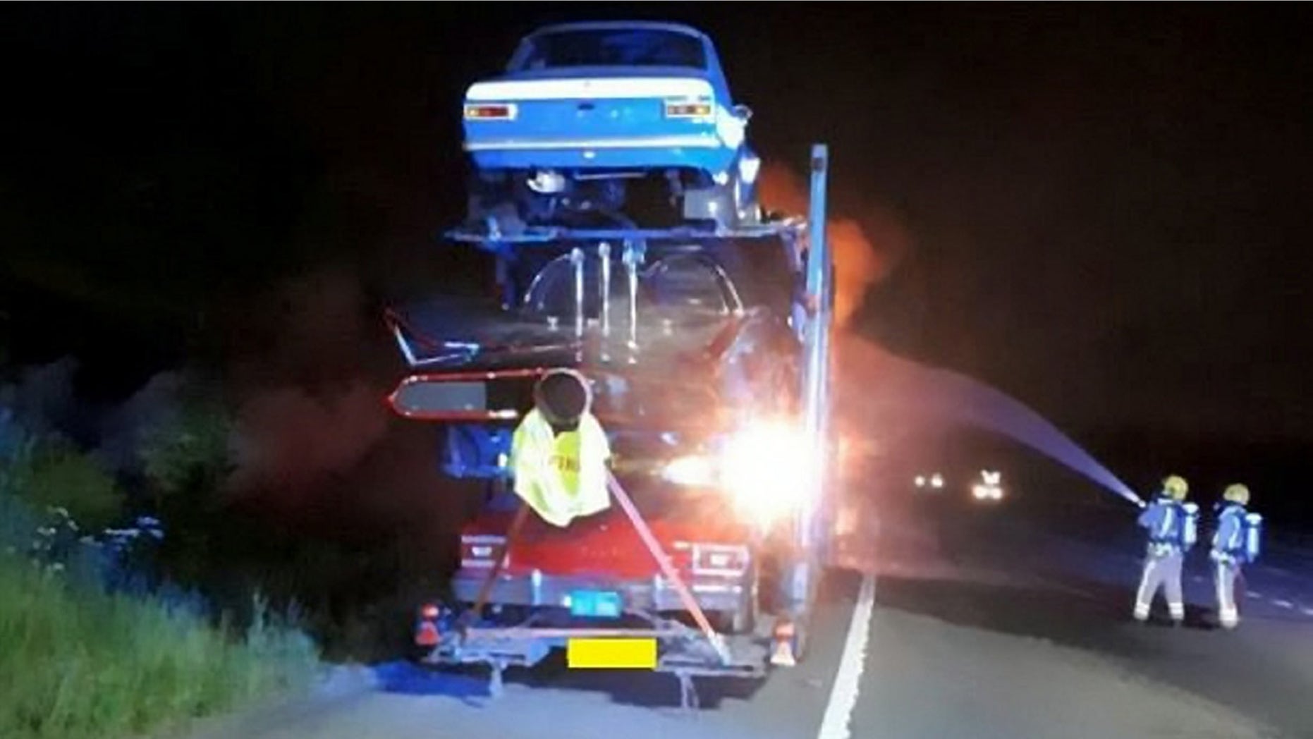 A transporter carrying a dozen novelty cars including a BATMOBILE caught fire - burning a number of vintage vehicle to bits. See SWNS story SWFIRE; The lorry was travelling westbound on the M4 near Bath on Wednesday night when it went up in flames. Highways England was forced to shut two lanes of the motorway as firefighters battled the blaze into the early hours of Thursday. It is not know the extent of damage the cars suffered, but Highways England said a number of the specialists cars along with the transporter cab had been destroyed. The truck had been transporting a number of classic cars including a âDukes of Hazzardâ General Lee, Batmobile, âTransformersâ Ford Mustang and âStarsky and Hutchâ Ford Torino.