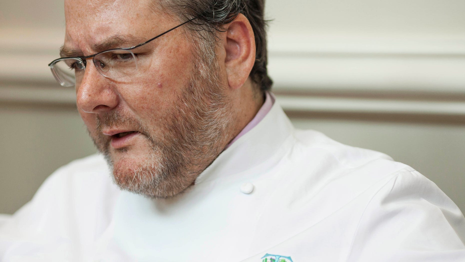 FILE - In this Aug. 28, 2012 file photo, award-winning chef Charlie Trotter is seen during an interview with The Associated Press at his restaurant in Chicago. On Monday, Nov. 11, 2013, a memorial service is being held in Chicago for Trotter who died Tuesday, Nov. 5, at a Chicago hospital after paramedics found him unresponsive at his home. He was 54. (AP Photo/Sitthixay Ditthavong, File)
