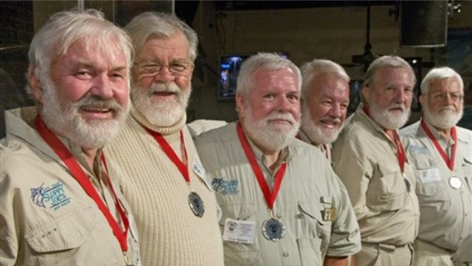 In this photo, released by the Florida Keys News Bureau, some of the semi-finalists of the 2011 "Papa" Hemingway Look-Alike Contest including, from left, Arnie Inge-Mathisen, Bear Hoochuck, Greg Fawcett, Charlie Boice, Ed Lindoo and Frank Long show their to looks to the audience during the first of two preliminary rounds Thursday, July 21, 2011, at Sloppy Joe's Bar in Key West, Fla. More than 120 men resembling Ernest Hemingway are entered into the contest that is a facet of Key West's annual Hemingway Days festival. The finals are set for Saturday, July 23.