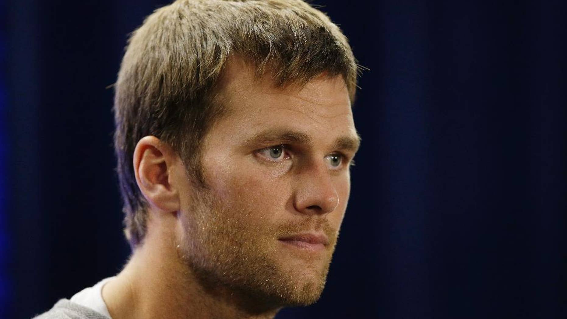 New England Patriots quarterback Tom Brady listens to a reporter's question during a media availability at the NFL football team's facility Wednesday, Oct. 8, 2014 in Foxborough, Mass. The Patriots play the Buffalo Bills in Buffalo on Sunday. (AP Photo/Stephan Savoia)