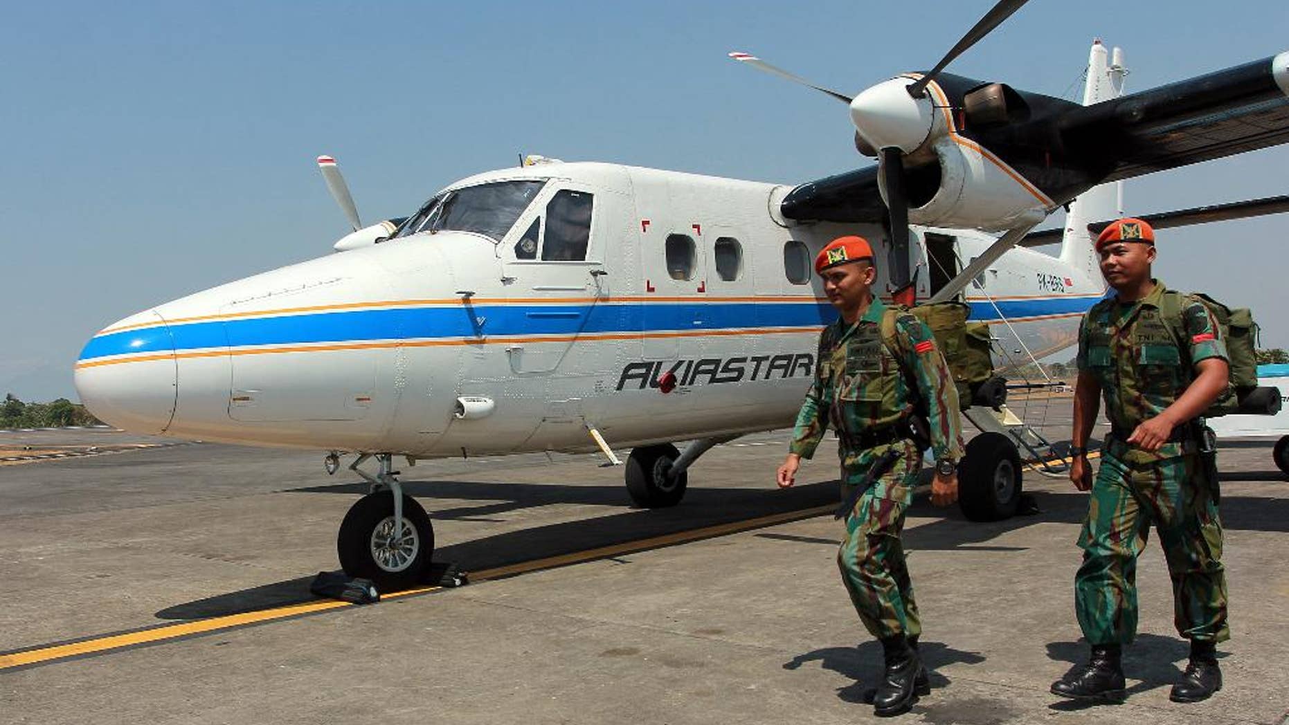 A member of the National Search And Rescue Agency (BASARNAS) examines a map of Sulawesi Island, at the crisis centre searching for the missing DHC-6 Twin Otter plane owned by Aviastar Mandiri airline, at Sultan Hasanuddin airport in Makassar, Indonesia, Monday, Oct. 5, 2015. Indonesian rescuers say the wreckage of the small plane carrying 10 people that went missing three days ago has been found. (AP Photo)