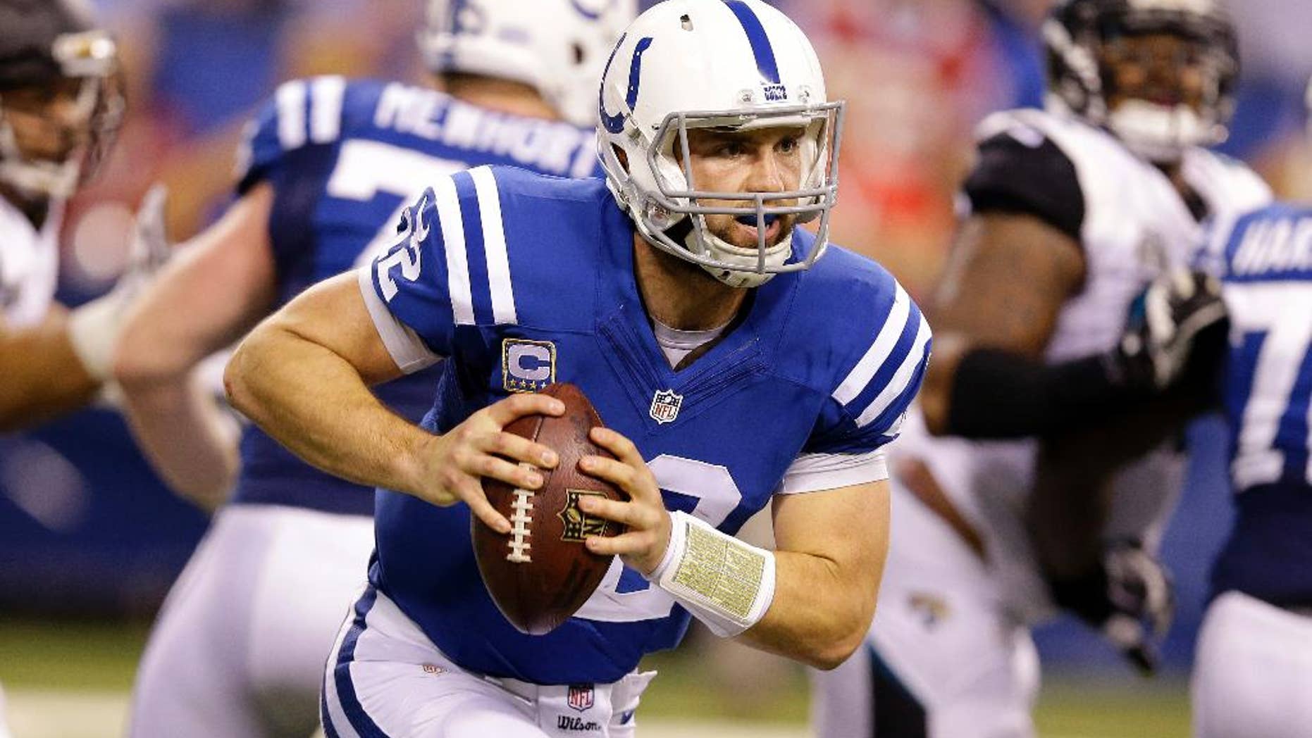 Indianapolis Colts quarterback Andrew Luck (12) runs during the first half of an NFL football game against the Jacksonville Jaguars, Sunday, Nov. 23, 2014, in Indianapolis. (AP Photo/Michael Conroy)