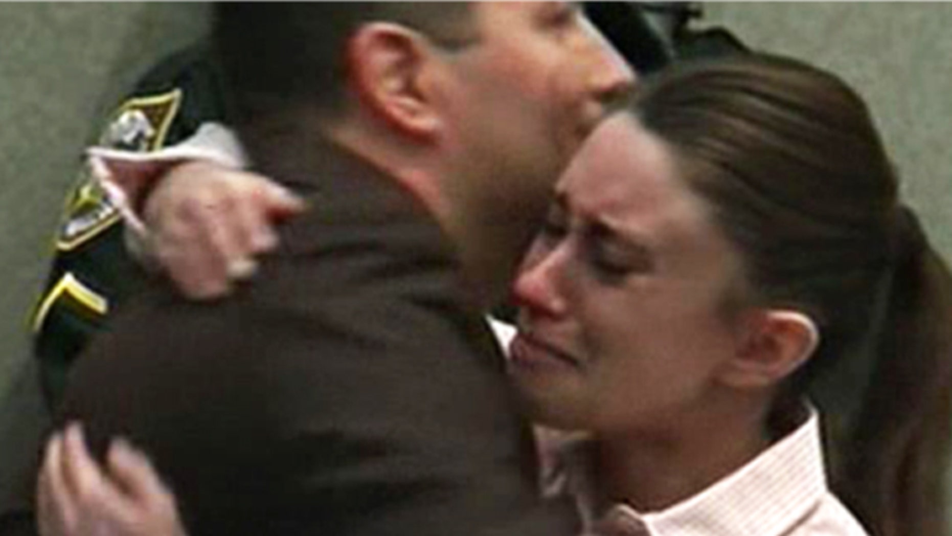 July 5: Casey Anthony hugs her attorney, Jose Baez, after hearing a jury clear her of killing her 2-year-old daughter, Caylee.
