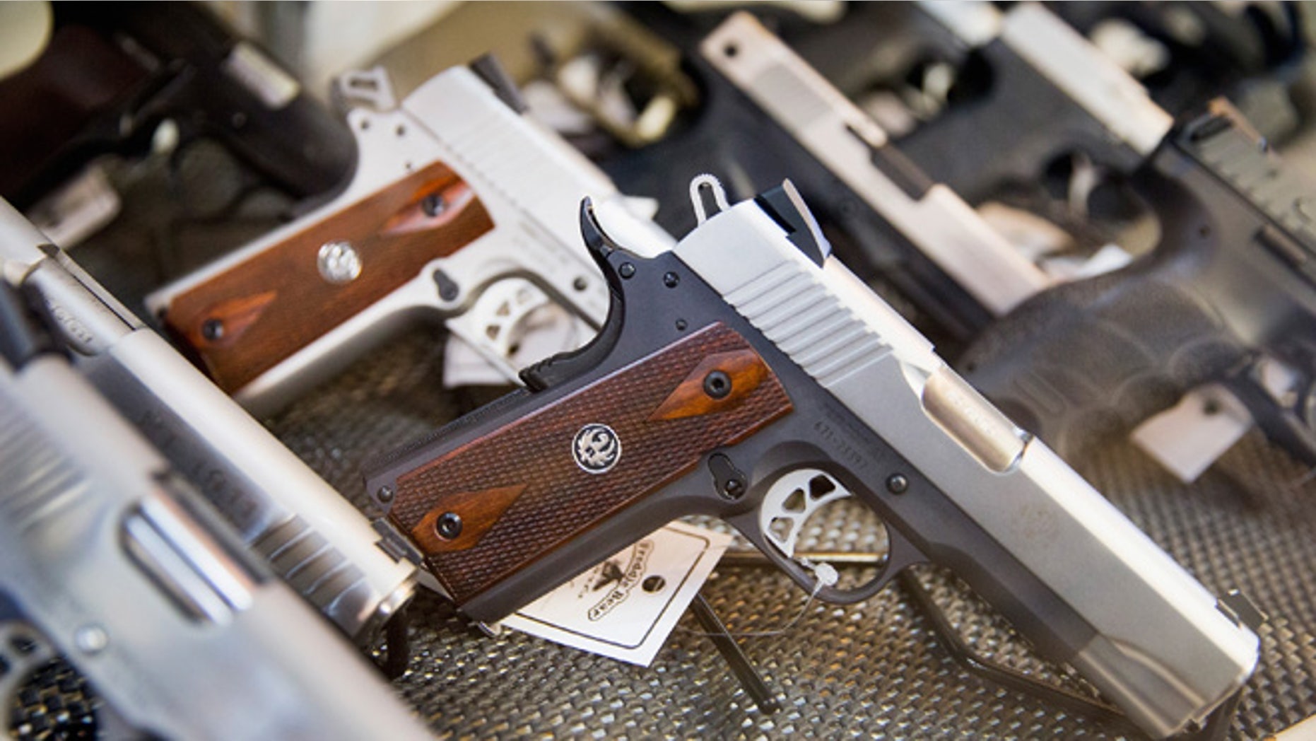 TINLEY PARK, IL - MARCH 11: Handguns are offered for sale at Freddie Bear Sports on March 11, 2015 in Tinley Park, Illinois. According to a survey conducted by the University of Chicago 32 percent of Americans own guns, down from a high of 50 percent of the population in the 1970s and early 1980s. (Photo by Scott Olson/Getty Images)