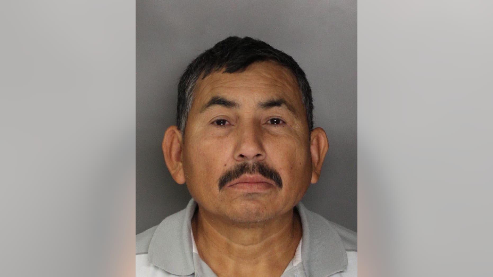 In this handout photo released by the Sacramento County Sheriff's Department is Genaro Olaguez, who was arrested and sent back to Mexico on allegations that he killed eight government officials in Mexico. Olaquez was arrested in Sacramento, Calif., Tuesday, Dec. 3, 2013, in connection with the May 2, 2000, murders of a commissioner and seven other city officials in Sinaloa, Mexico.(AP Photo/Sacramento County Sheriff's Department)