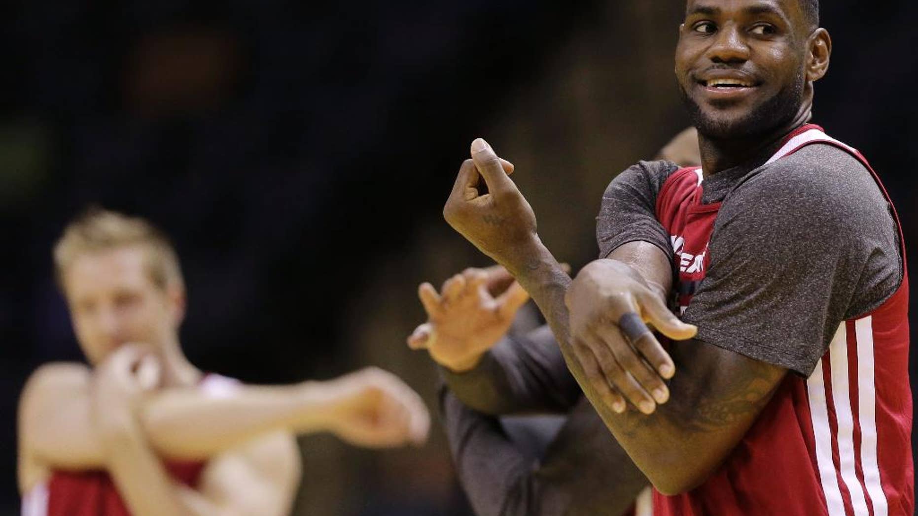 Miami Heat forward LeBron James warms up during basketball practice on Wednesday, June 4, 2014 in San Antonio. They play Game 1 of the NBA Finals against the San Antonio Spurs on Thursday. (AP Photo/Eric Gay)