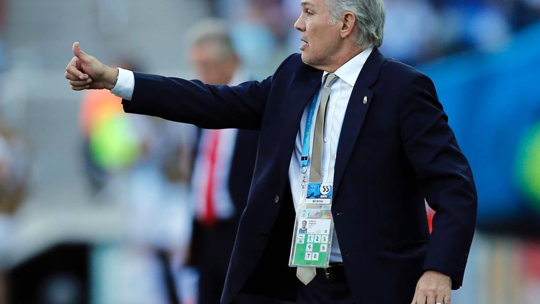 FILE - In this July 1, 2014, file photo, Argentina's head coach Alejandro Sabella signals to his players during the World Cup round of 16 soccer match between Argentina and Switzerland at the Itaquerao Stadium in Sao Paulo, Brazil. Sabella reported for several weeks to be ready to resign from the job and is expected to make it official on Wednesday July 30, 2014. (AP Photo/Victor R. Caivano, File)