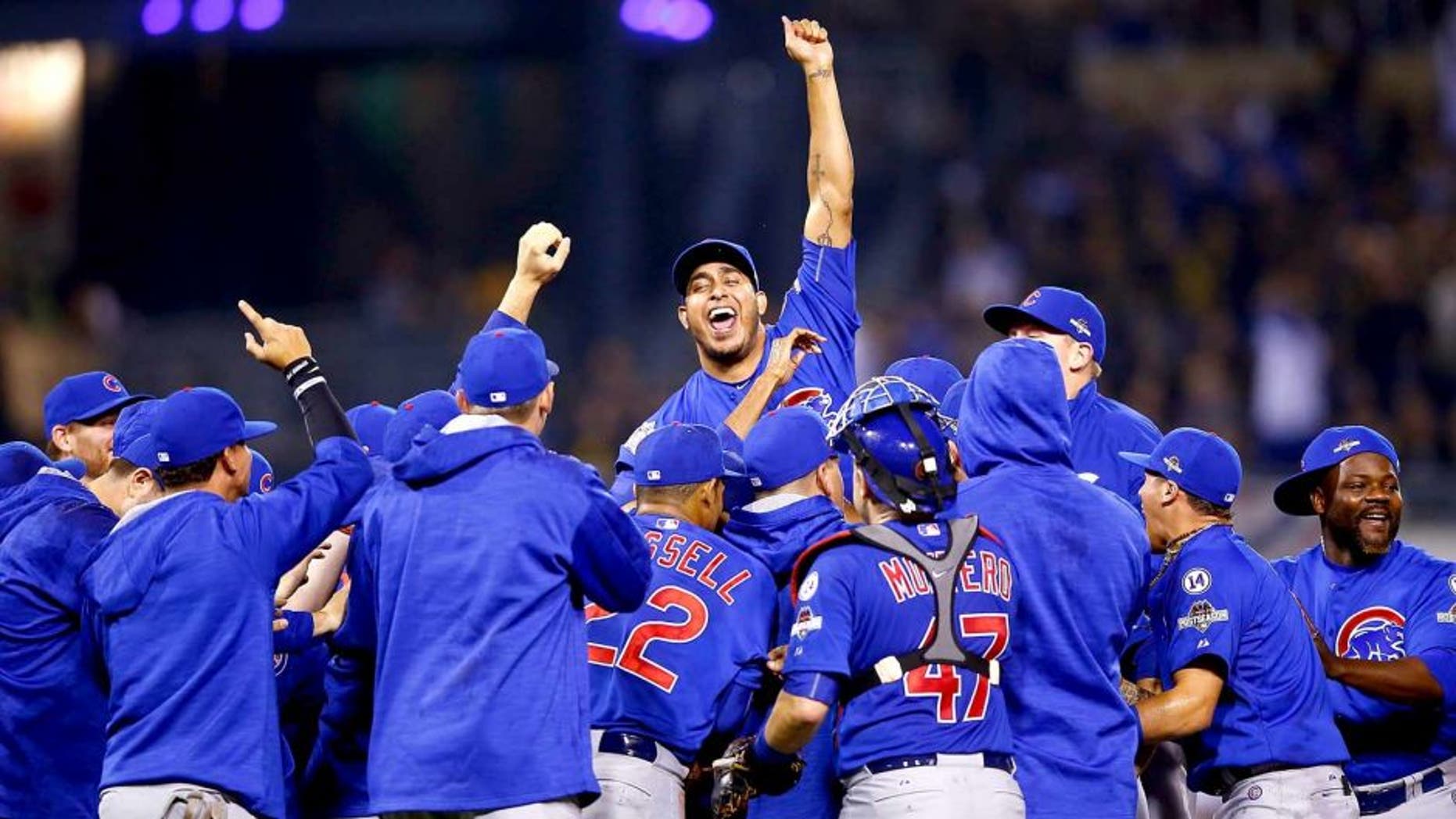 PITTSBURGH, PA - OCTOBER 07: The Chicago Cubs celebrate defeating the Pittsburgh Pirates to win the National League Wild Card game at PNC Park on October 7, 2015 in Pittsburgh, Pennsylvania. The Chicago Cubs defeated the Pittsburgh Pirates with a score of 4 to 0. (Photo by Jared Wickerham/Getty Images)