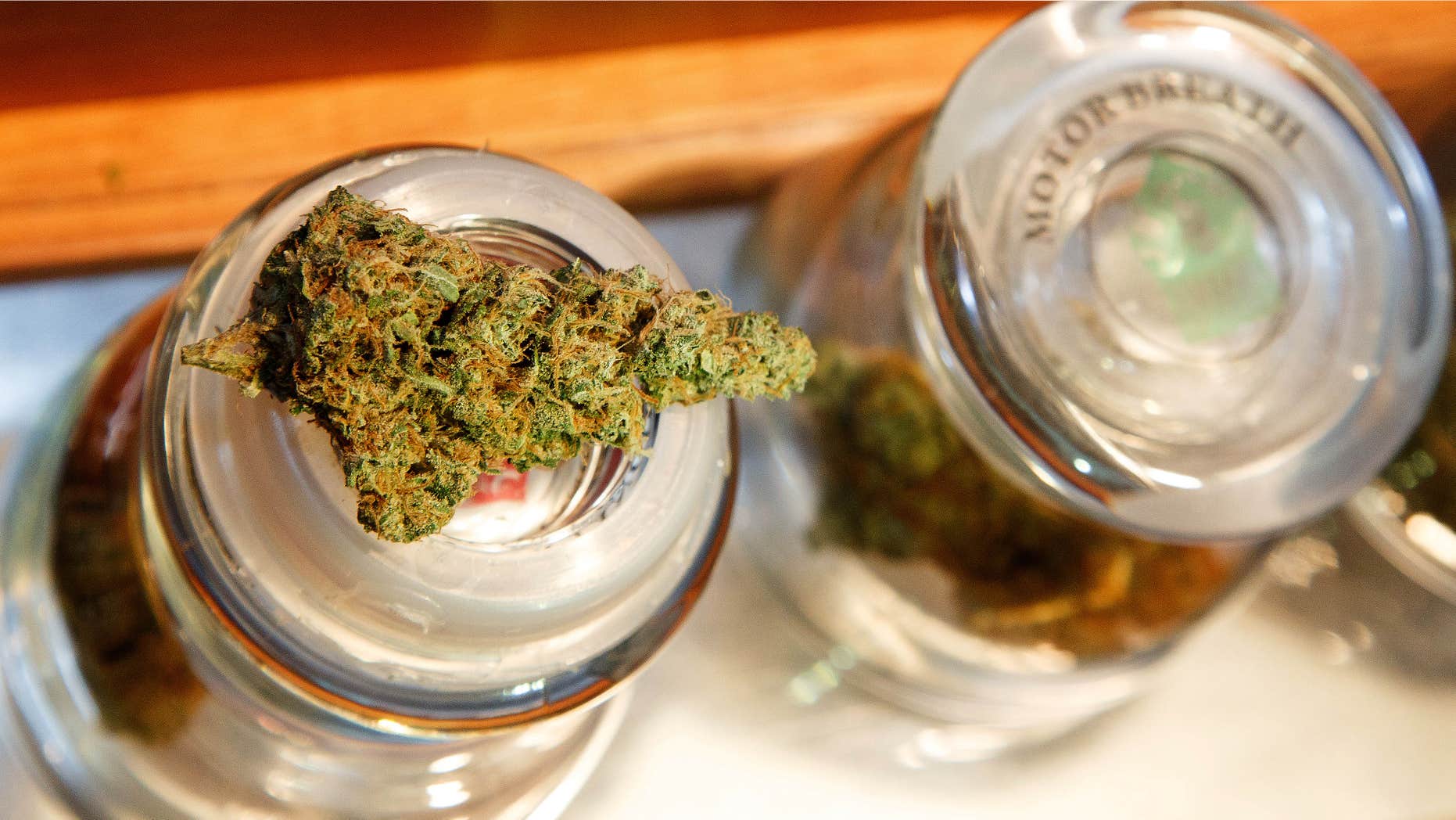 Sept. 28, 2015: A cannabis bud rests on a container at Amazon Organics, a pot dispensary in Eugene, Ore.