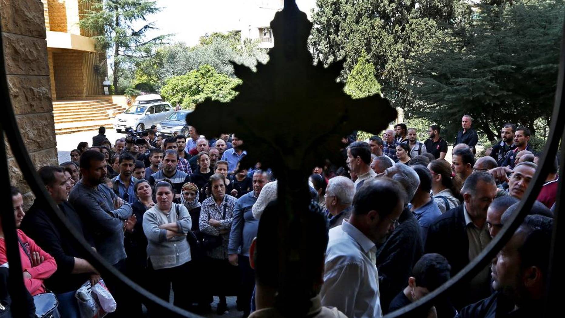Syrian and Iraqi Christians have fled ISIS and ended up in Lebanon, among other locations. (AP Photo/Bilal Hussein)