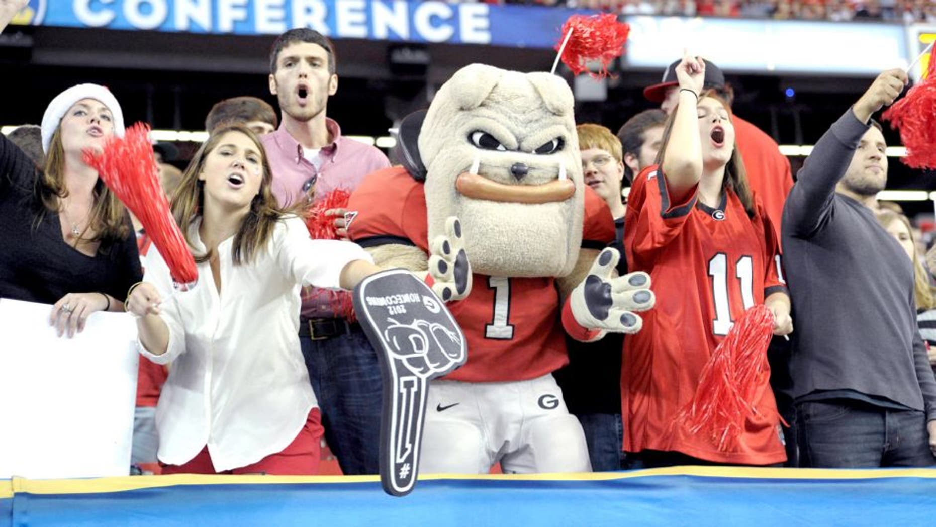Dec 1, 2012; Atlanta, GA, USA; The Georgia Bulldogs mascot cheers with fans during the third quarter of the 2012 SEC Championship game against the Alabama Crimson Tide at the Georgia Dome. Mandatory Credit: Paul Abell-USA TODAY Sports
