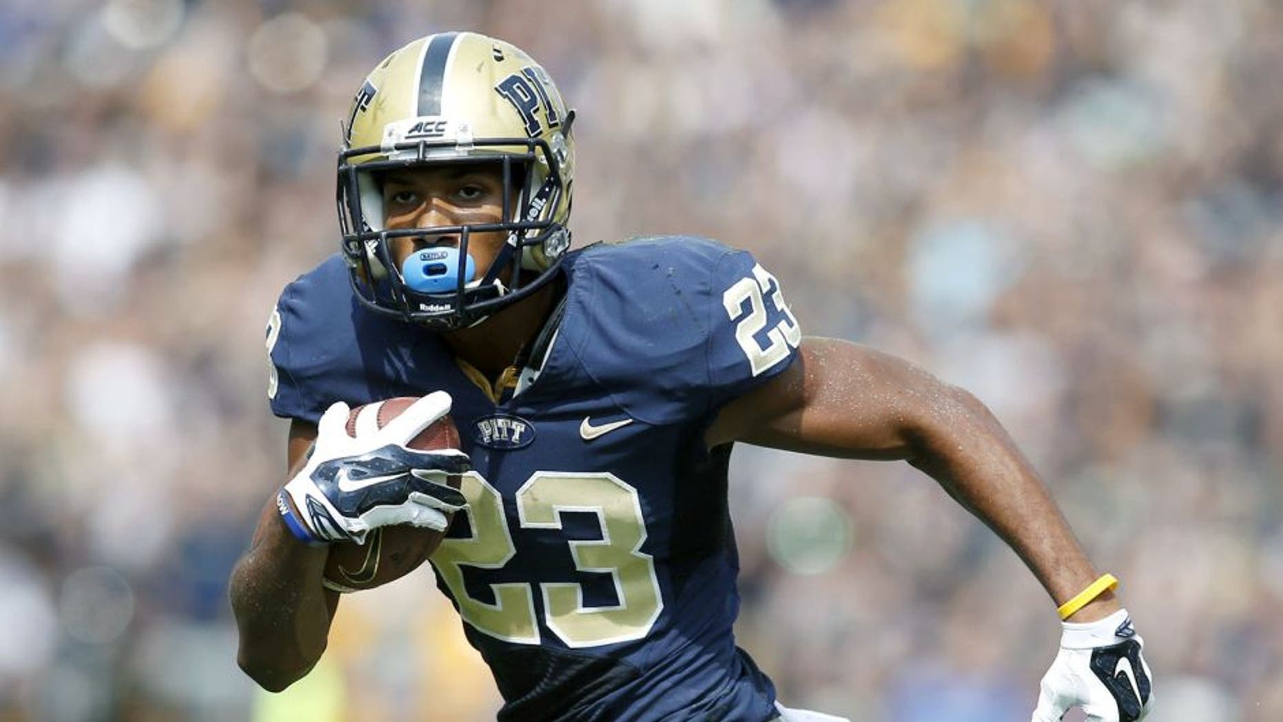Sep 20, 2014; Pittsburgh, PA, USA; Pittsburgh Panthers wide receiver Tyler Boyd (23) runs after a pass reception against the Iowa Hawkeyes during the second quarter at Heinz Field. Mandatory Credit: Charles LeClaire-USA TODAY Sports