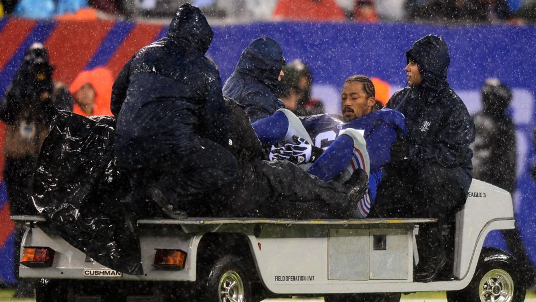 EAST RUTHERFORD, NJ - DECEMBER 29: Tackle Will Beatty #65 of the New York Giants leaves the game against the Washington Redskins with an injury during the second half at MetLife Stadium on December 29, 2013 in East Rutherford, New Jersey. (Photo by Ron Antonelli/Getty Images)