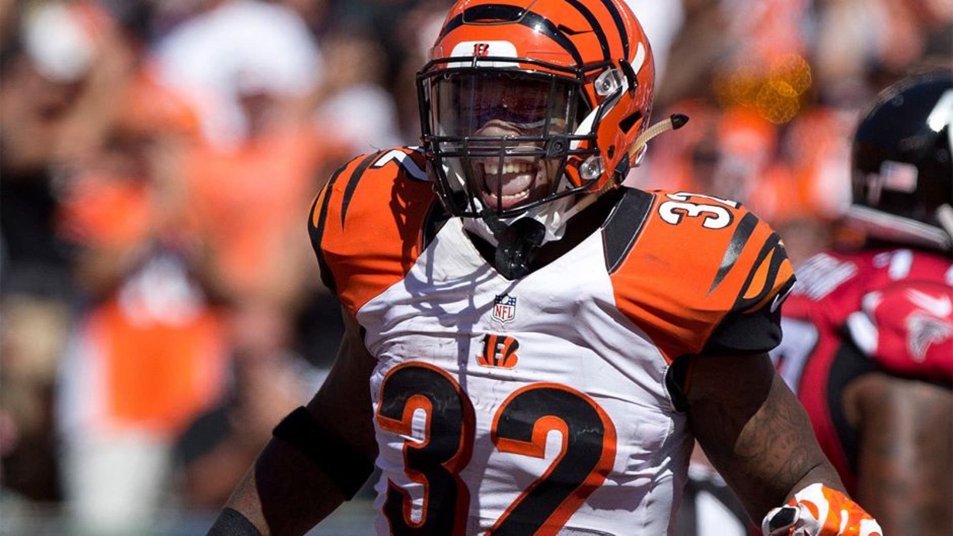 Sep 14, 2014; Cincinnati, OH, USA; Cincinnati Bengals running back Jeremy Hill (32) celebrates a touchdown in the second half against the Atlanta Falcons at Paul Brown Stadium. The Bengals won 24-10. Mandatory Credit: Aaron Doster-USA TODAY Sports