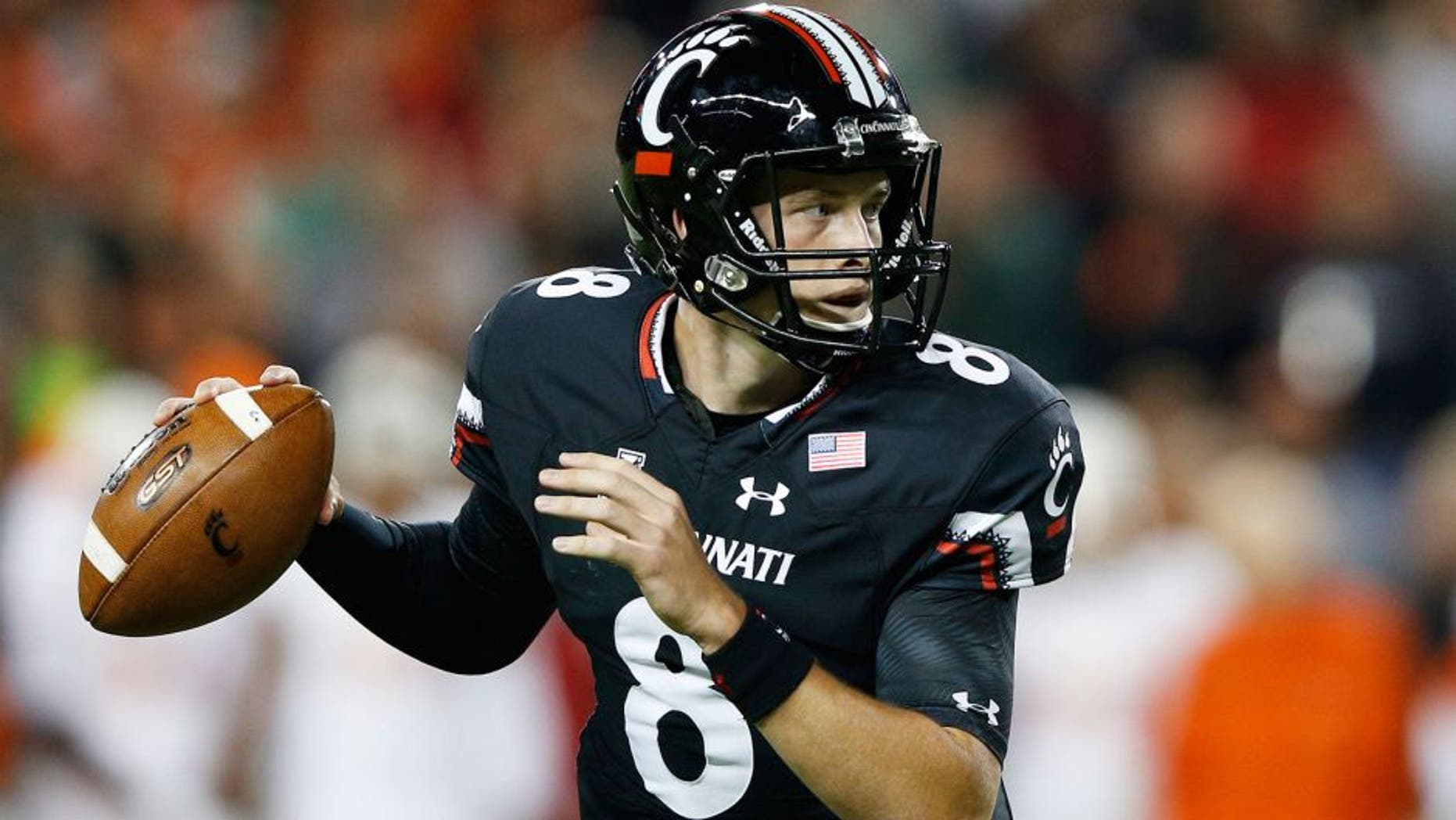 CINCINNATI, OH - OCTOBER 1: Hayden Moore #8 of the Cincinnati Bearcats looks to pass against the Miami Hurricanes in the first half at Nippert Stadium on October 1, 2015 in Cincinnati, Ohio. (Photo by Joe Robbins/Getty Images)