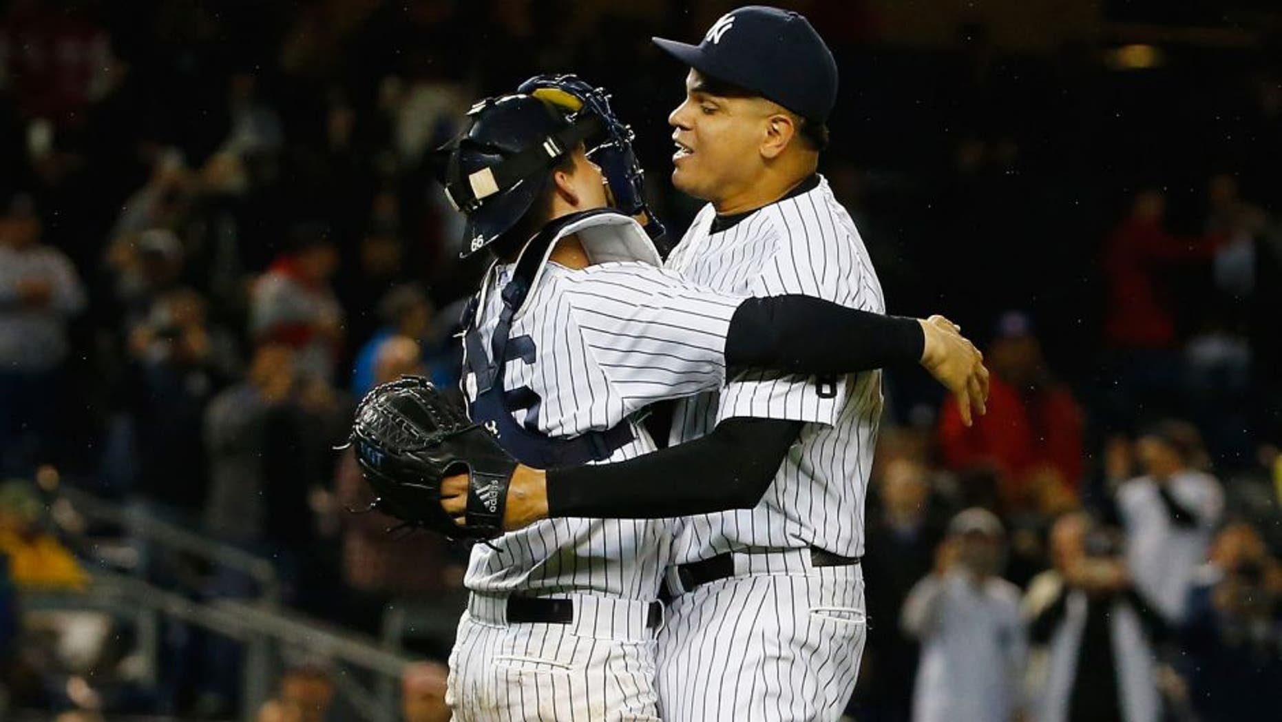 NEW YORK, NY - OCTOBER 01: John Ryan Murphy #66 of the New York Yankees and Dellin Betances #68 celebrate the New York Yankees 10000th win and their wildcard clinching berth to the playoffs against the Boston Red Sox after their game at Yankee Stadium on October 1, 2015 in New York City. (Photo by Al Bello/Getty Images)