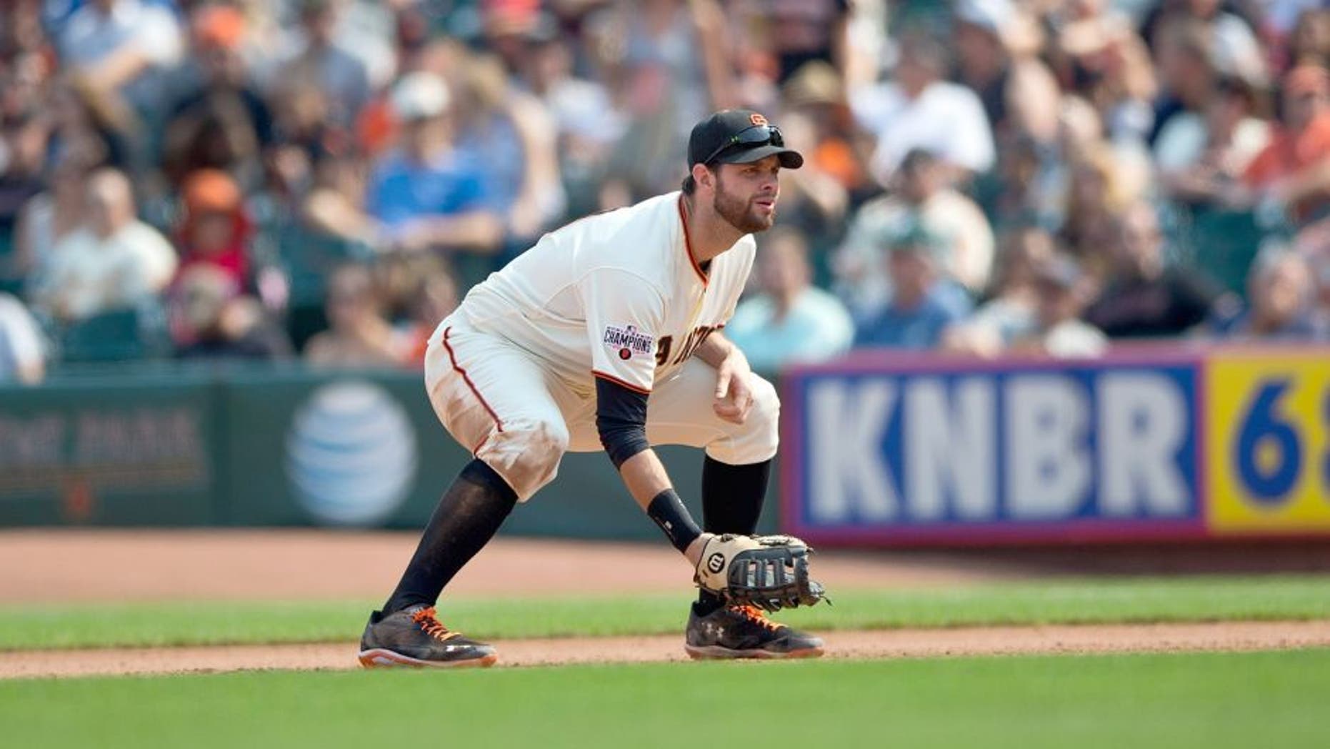 SAN FRANCISCO, CA - SEPTEMBER 13: Brandon Belt #9 of the San Francisco Giants stands on the field against the San Diego Padres during the seventh inning at AT&T Park on September 13, 2015 in San Francisco, California. The San Francisco Giants defeated the San Diego Padres 10-3. (Photo by Jason O. Watson/Getty Images)