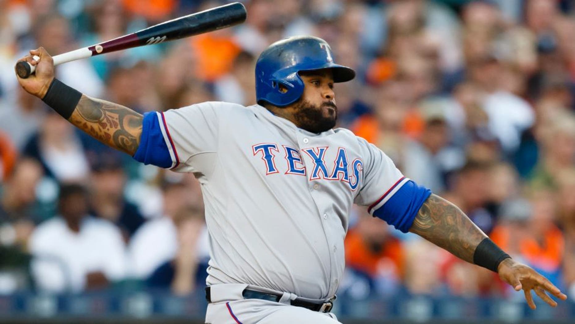 Aug 22, 2015; Detroit, MI, USA; Texas Rangers designated hitter Prince Fielder (84) hits an RBI single in the third inning against the Detroit Tigers at Comerica Park. Mandatory Credit: Rick Osentoski-USA TODAY Sports