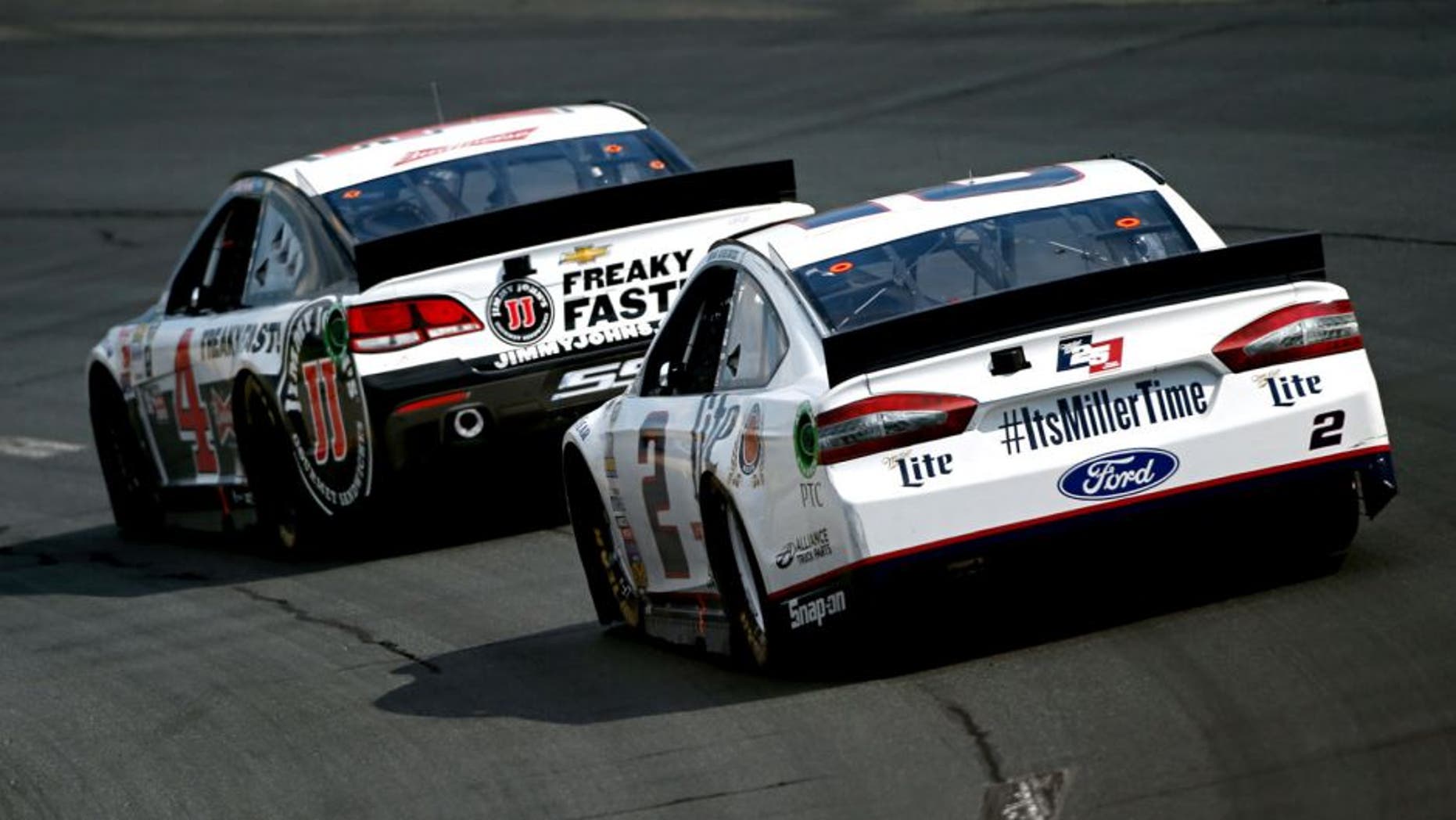 LOUDON, NH - JULY 19: Kevin Harvick, driver of the #4 Jimmy John's/Budweiser Chevrolet, leads Brad Keselowski, driver of the #2 Miller Lite Ford, during the NASCAR Sprint Cup Series 5-Hour ENERGY 301 at New Hampshire Motor Speedway on July 19, 2015 in Loudon, New Hampshire. (Photo by Todd Warshaw/NASCAR via Getty Images)