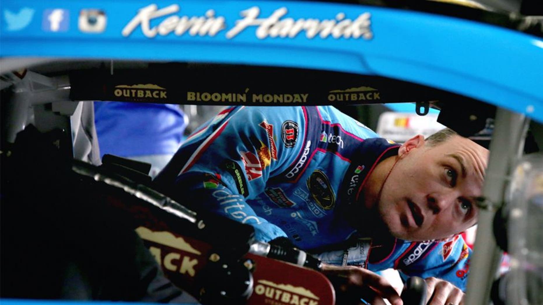 LOUDON, NH - SEPTEMBER 25: Kevin Harvick, driver of the #4 Ditech Chevrolet, stands in the garage area during practice for the NASCAR Sprint Cup Series Sylvania 300 at New Hampshire Motor Speedway on September 25, 2015 in Loudon, New Hampshire. (Photo by Sean Gardner/Getty Images)