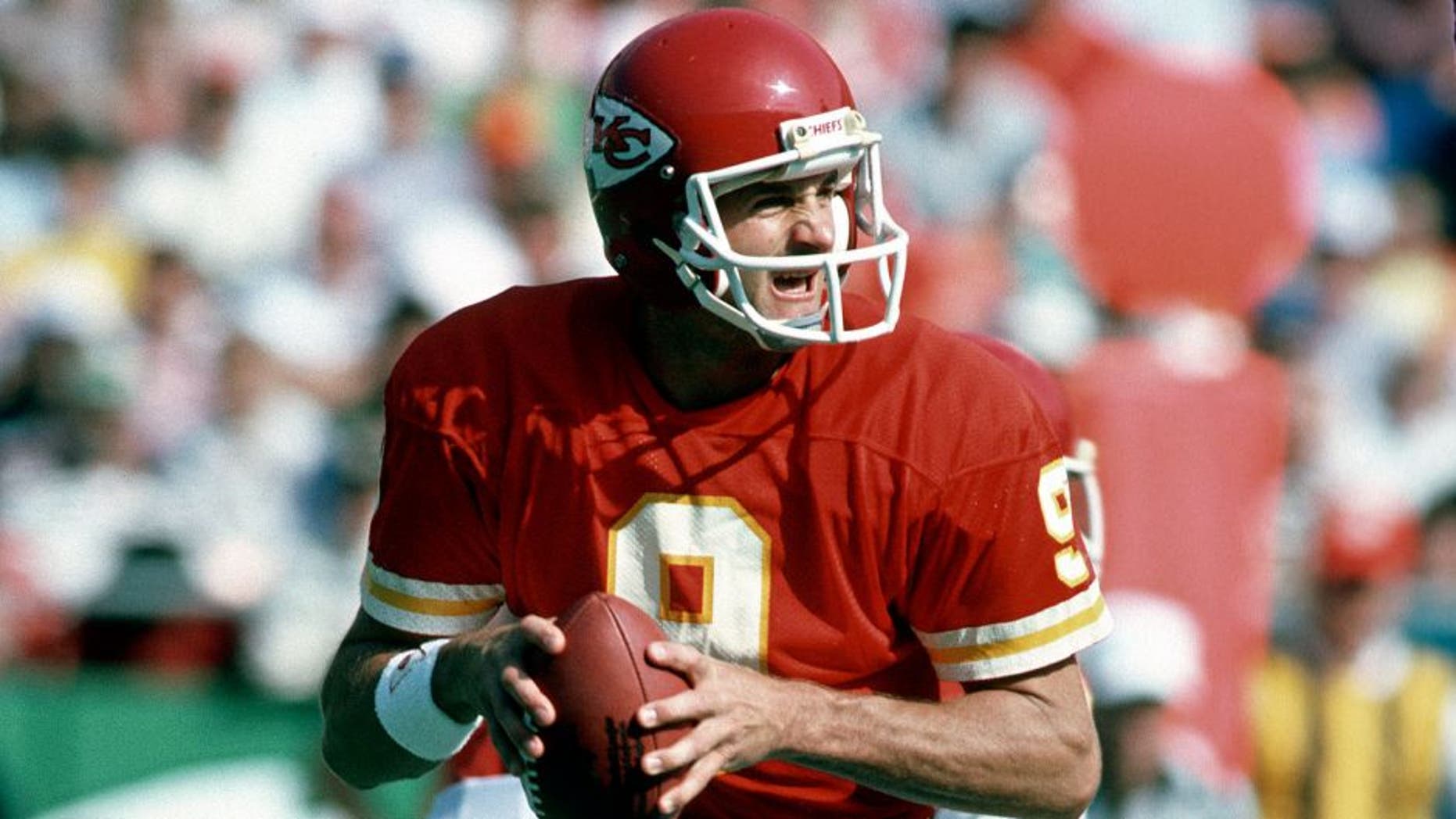 KANSAS CITY, MO - OCTOBER 27: Bill Kenney #9 of the Kansas City Chiefs drops back to pass against the Denver Broncos during an NFL football game October 27, 1985 at Arrowhead Stadium in Kansas City, Missouri. Kenney played for the Chiefs from 1980-88. (Photo by Focus on Sport/Getty Images)